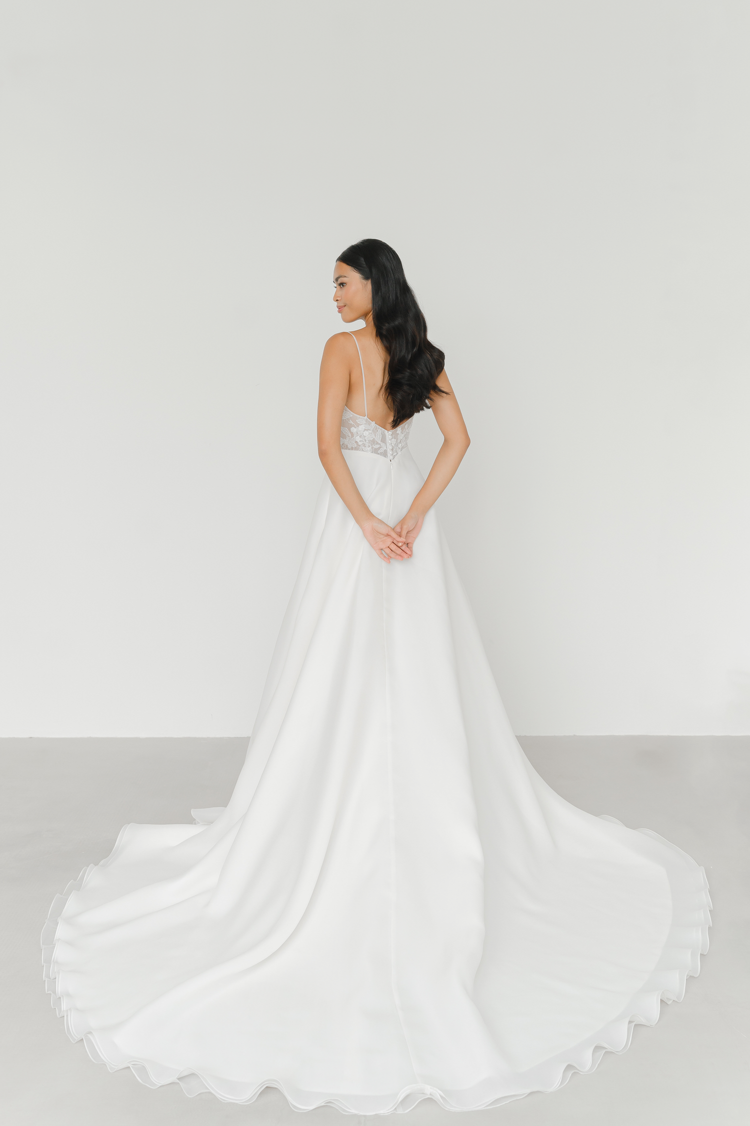 Layla bridal gown back view with an elegant flowing silhouette