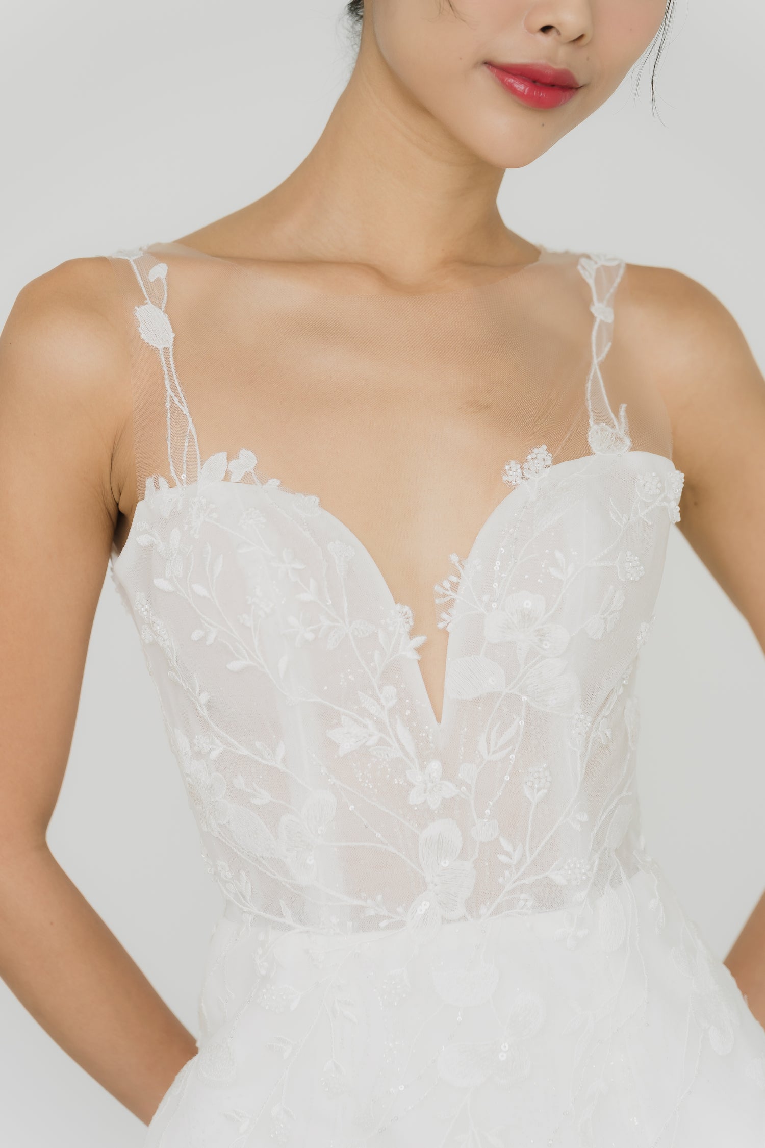 Close-up of Leia bridal gown showcasing the barely-there illusion neckline