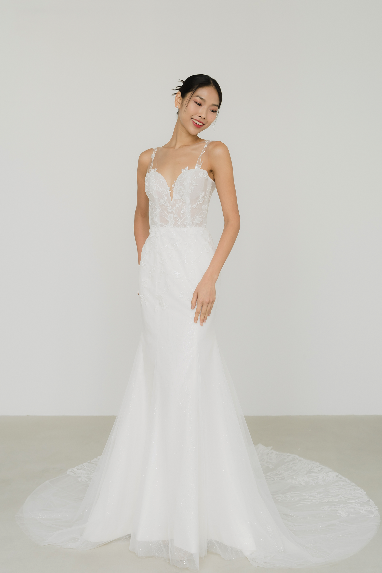 Leia wedding dress featuring intricate beaded lace detailing and a flattering fitted silhouette