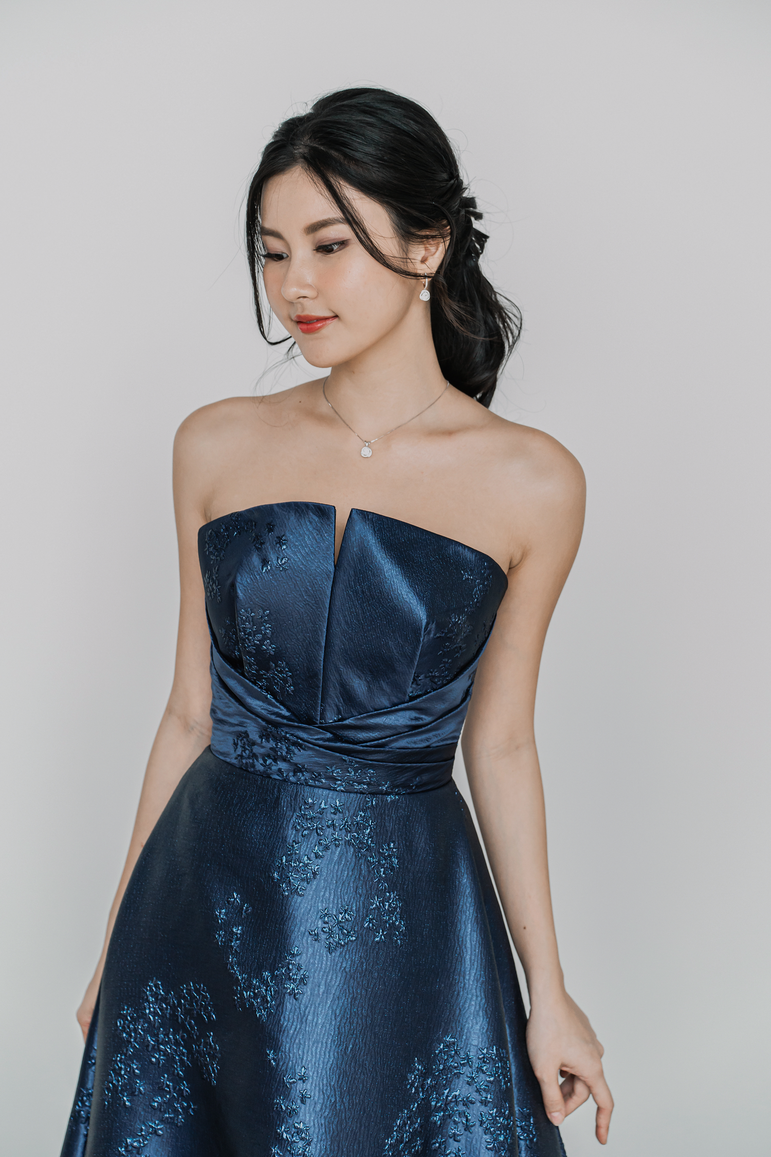 Leona bridal evening gown front view with a strapless neckline