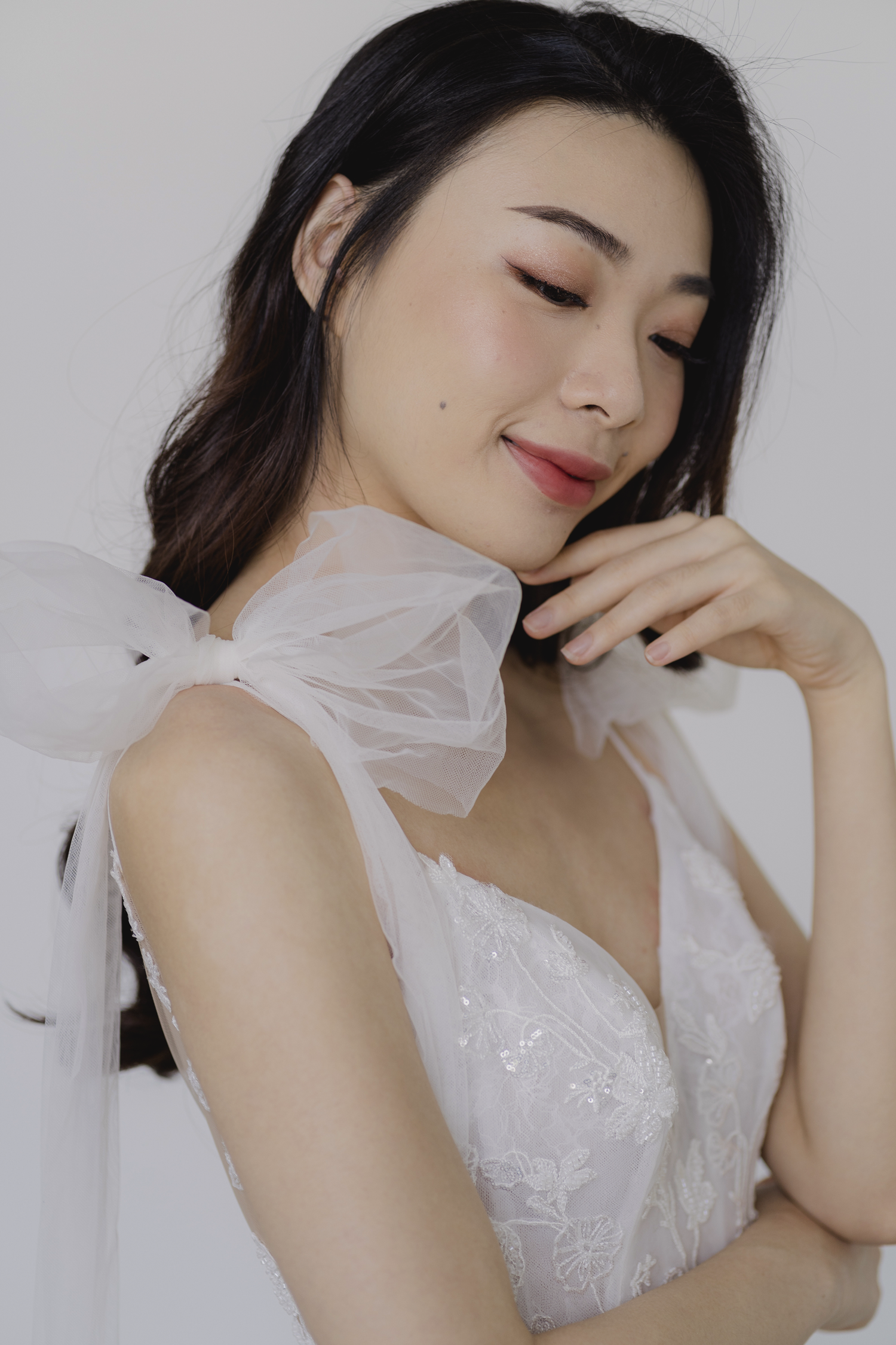 Lexi wedding gown styled with a detachable tulle shoulder ribbon