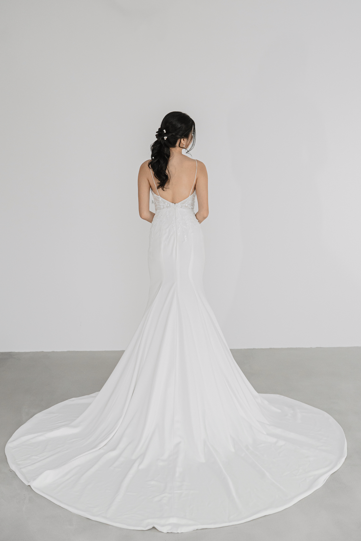 Liyana bridal gown featuring a clean crepe train