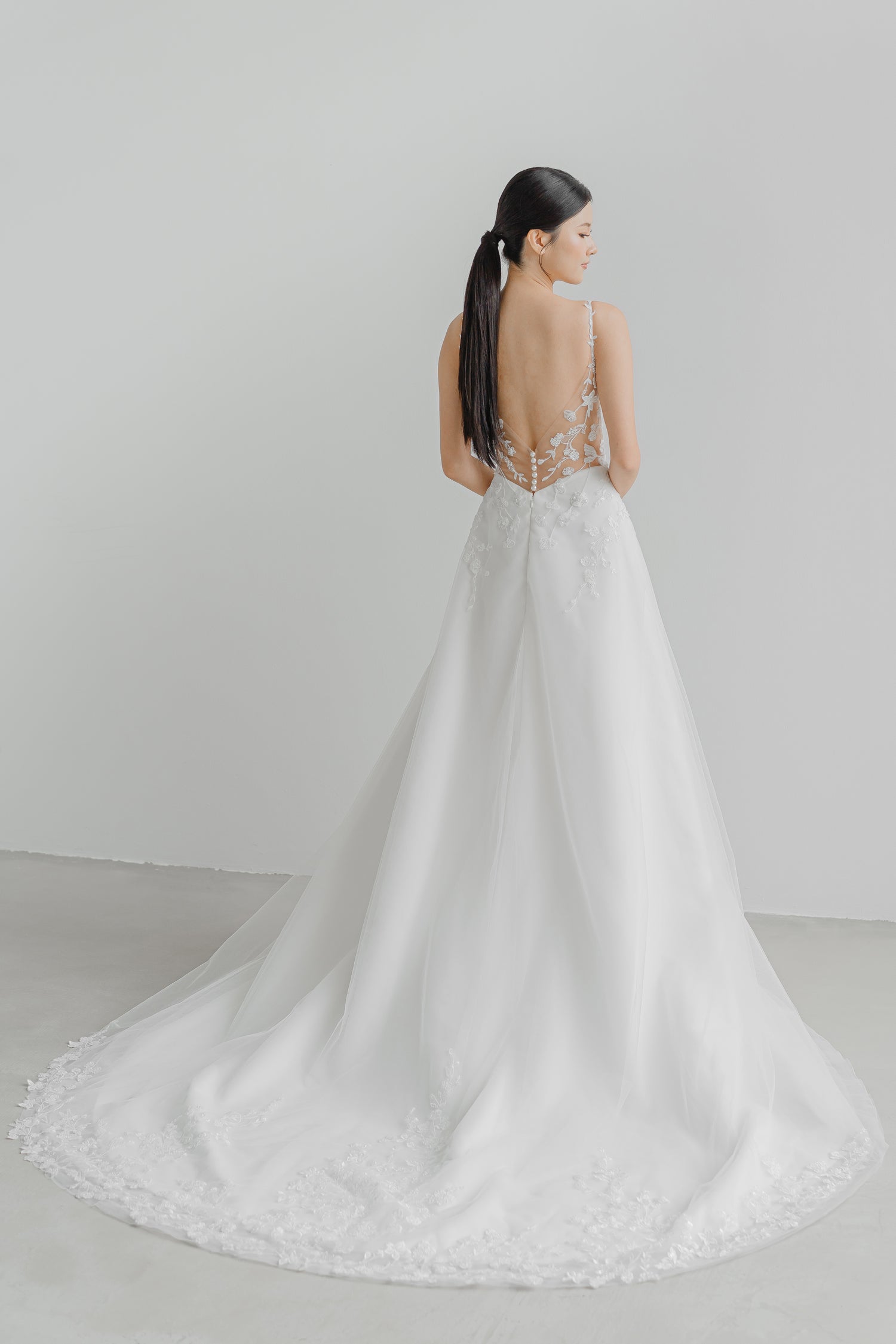 Lyra bridal gown train showcasing the sparkling glitter fabric and flowing train