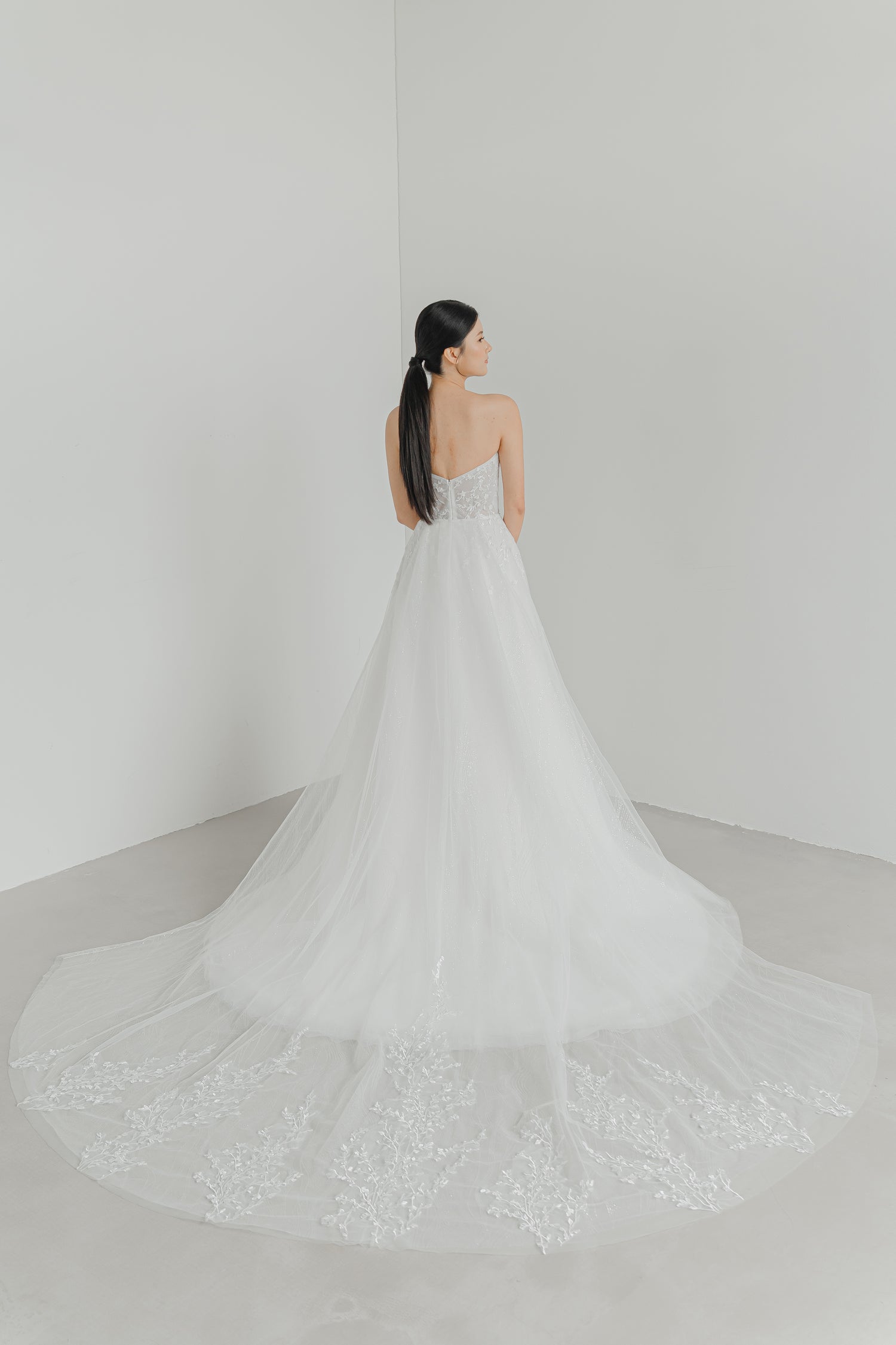 Madelyn bridal gown with the detachable lace train creating a dramatic bridal entrance