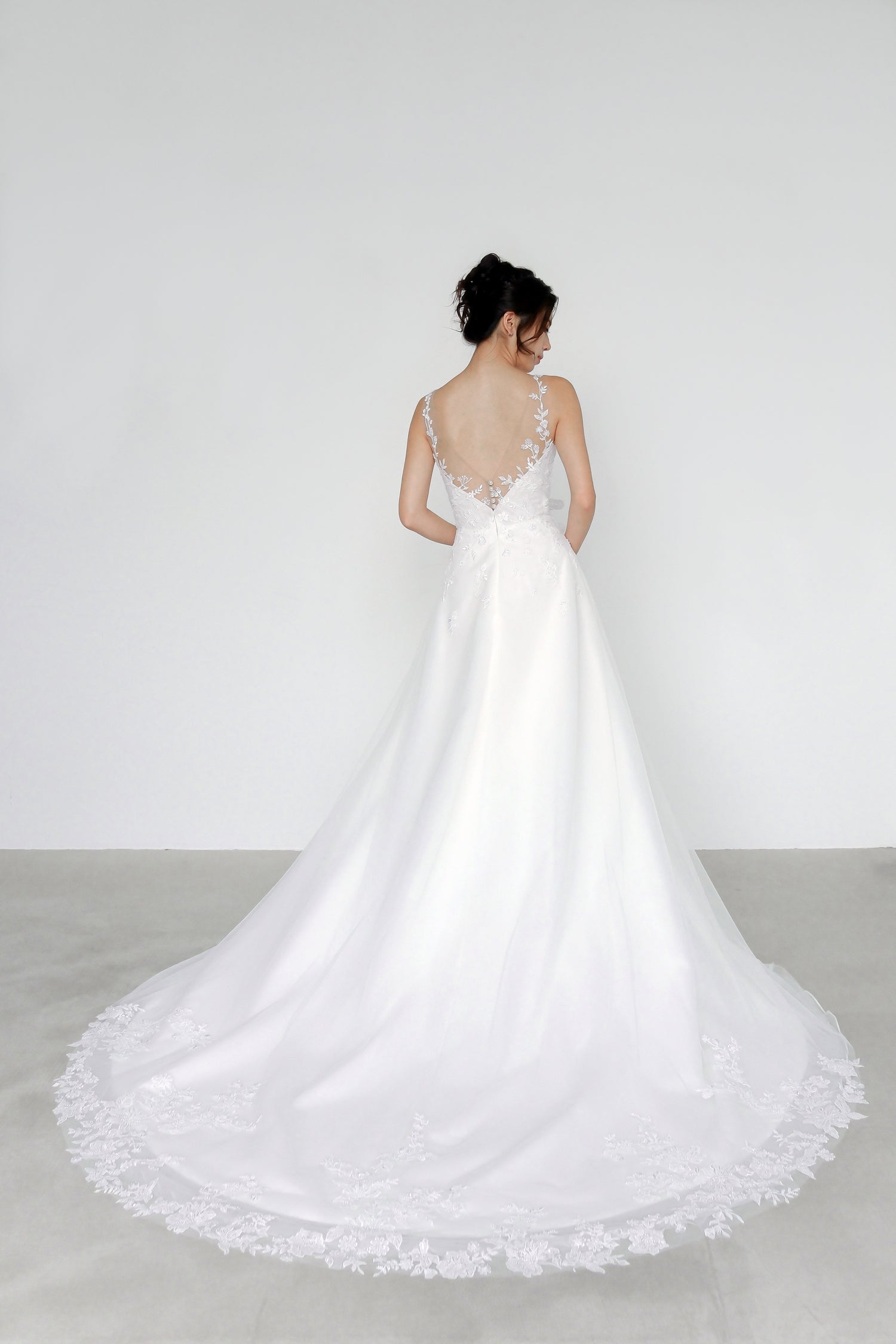 Meara bridal gown back view with an elegant flowing tulle skirt
