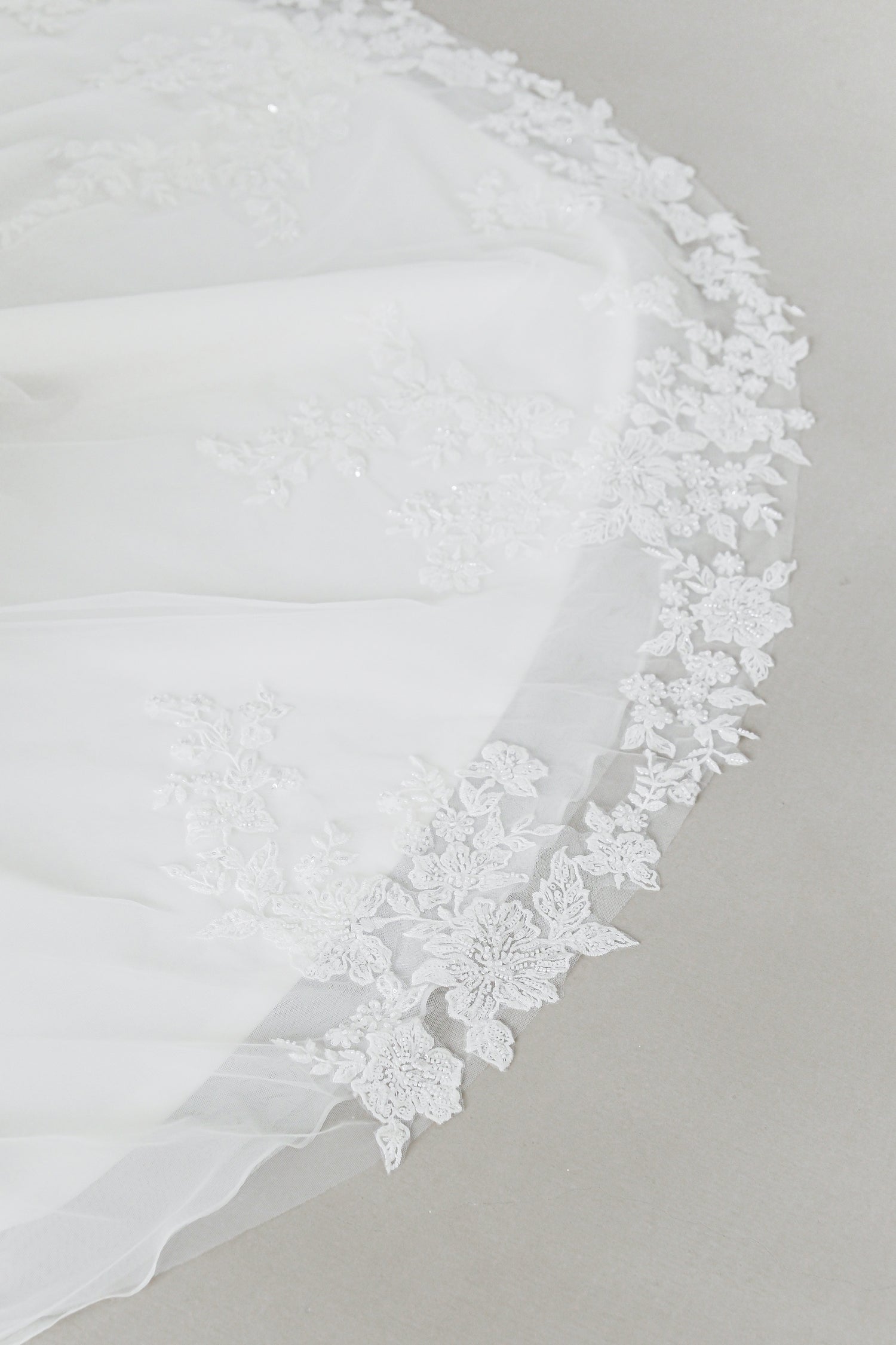 Close-up of Meara wedding dress highlighting the delicate floral lace detailing