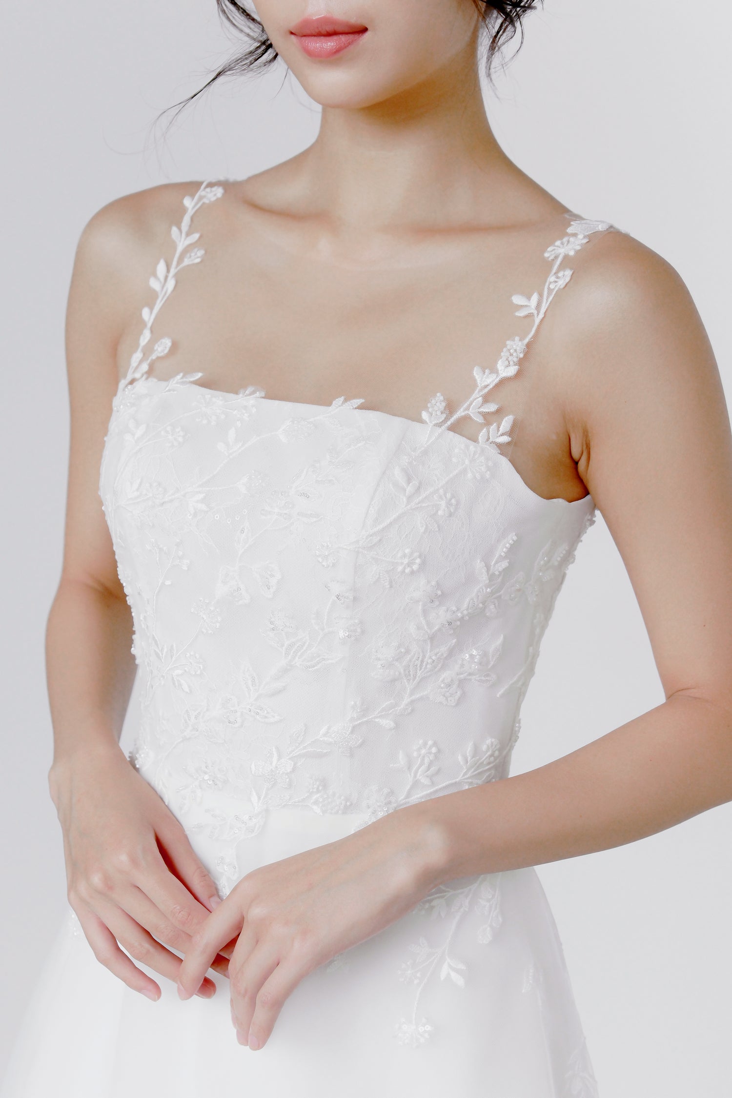 Meara wedding dress front view with an illusion neckline and timeless A-line silhouette