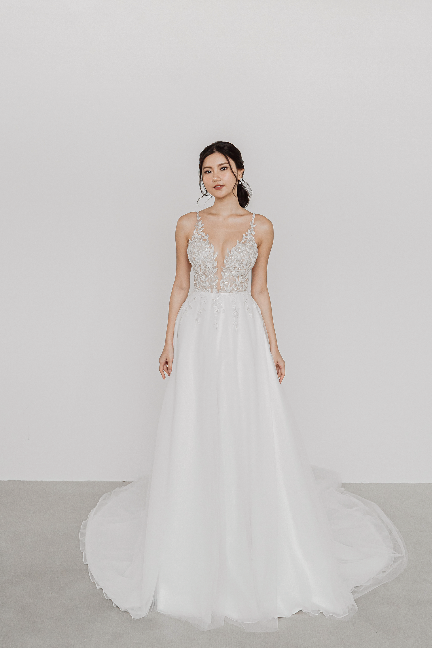 Mindy bridal gown featuring intricate beaded leafy appliqués and a romantic A-line silhouette