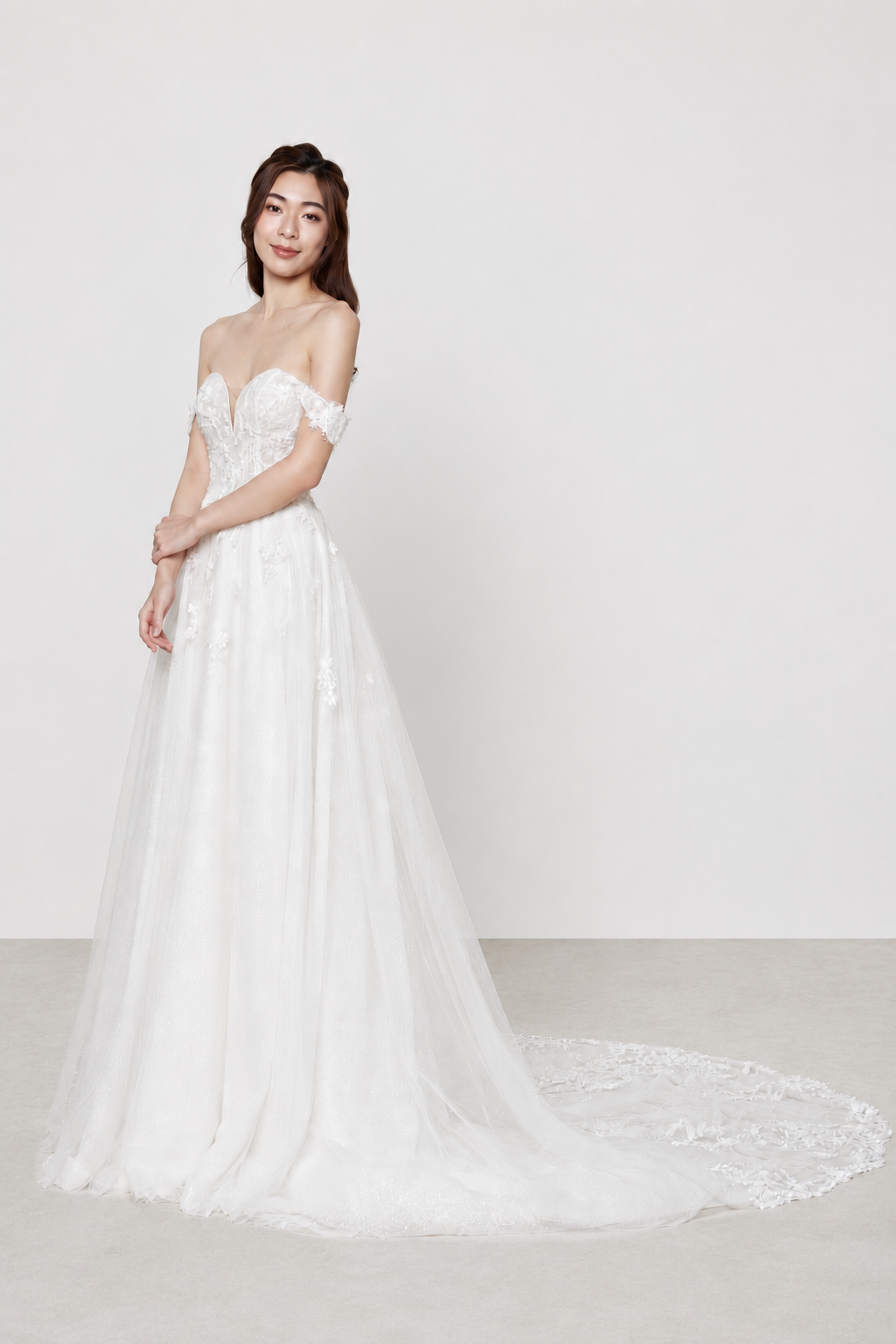 Mira wedding dress front view with a sweetheart neckline and glitter tulle silhouette