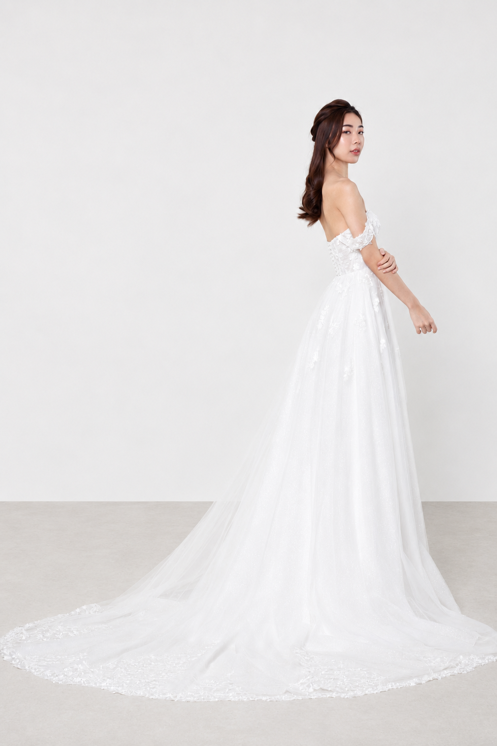 Mira wedding gown side view showcasing the elegant fitted silhouette