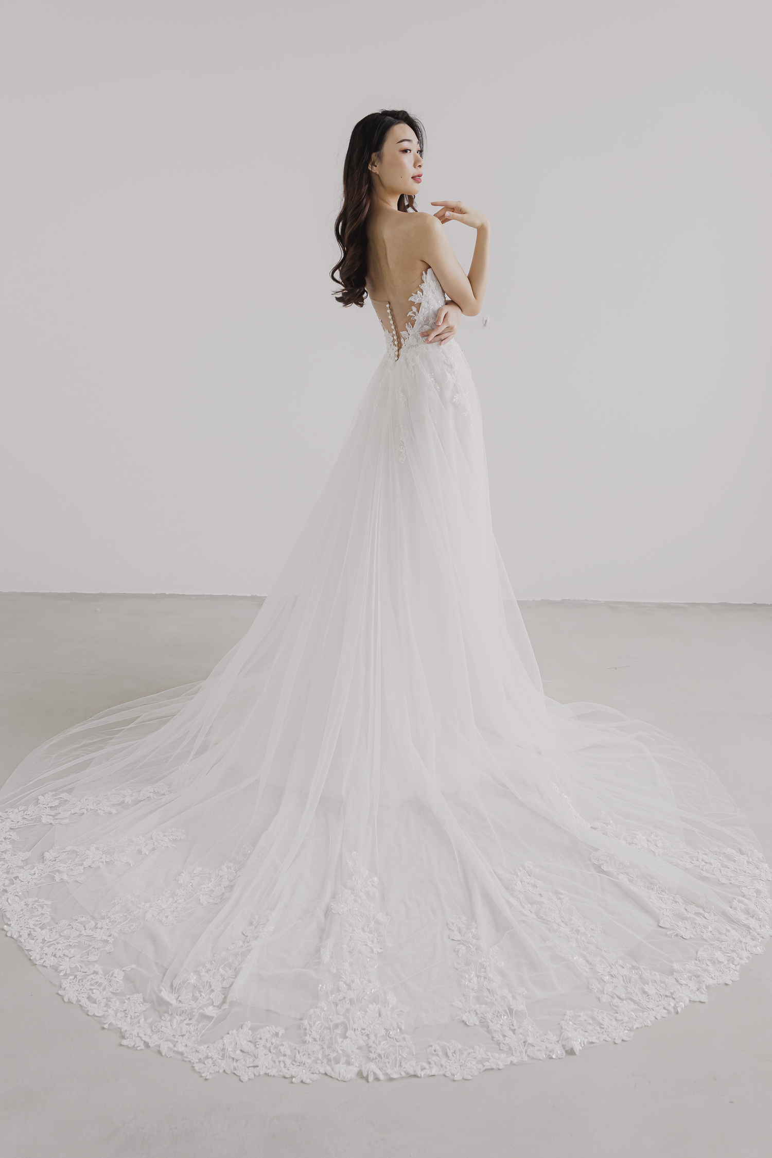 Miriam bridal gown featuring an elaborate lace train