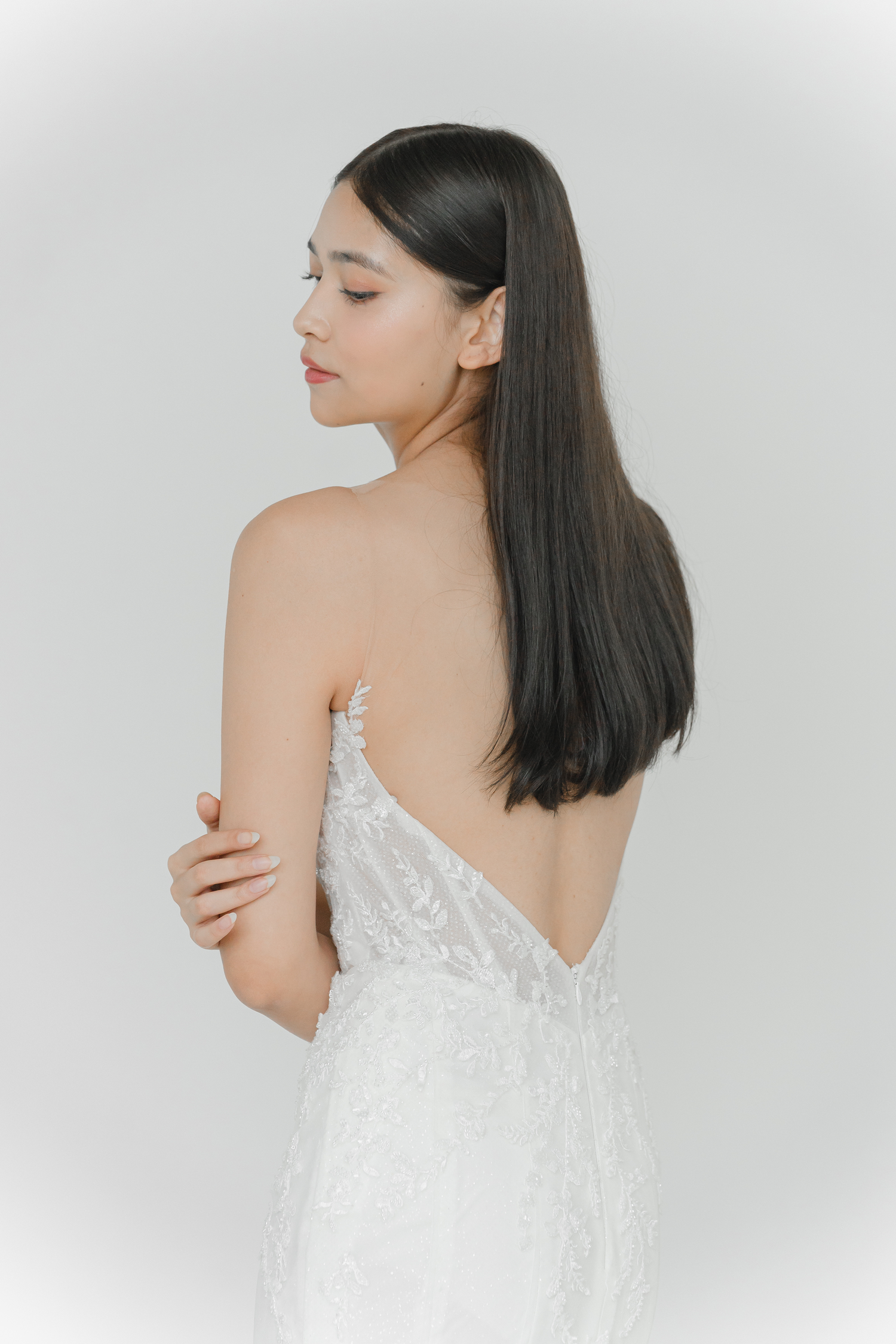 Close-up of Monica wedding dress with intricate beaded lace detailing