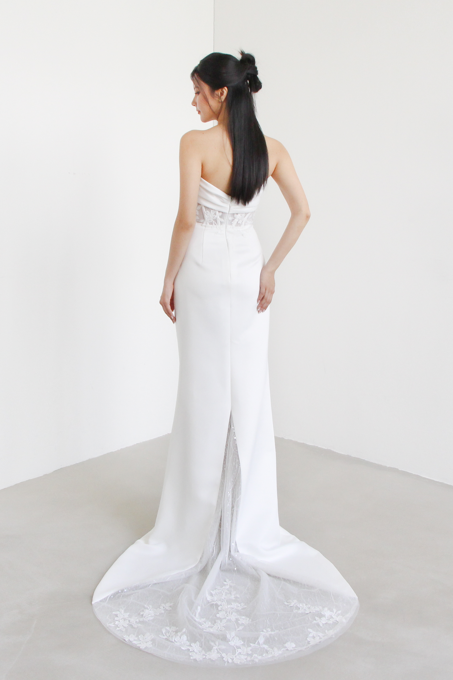 Nayara bridal gown back view with a peekaboo lace train
