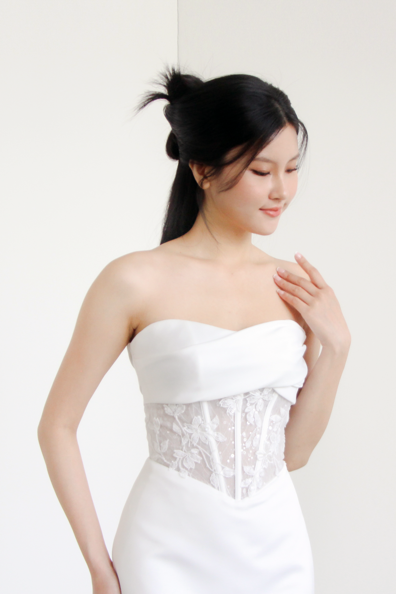Nayara bridal gown featuring a sparkling lace corset bodice and sleek crepe silhouette