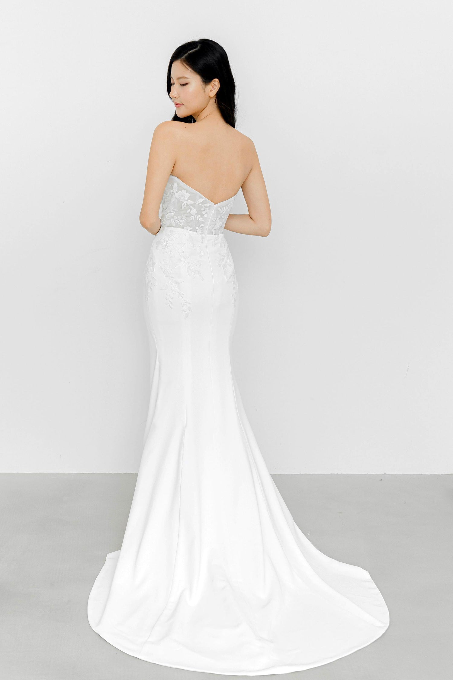 Nerissa wedding gown train showcasing the elegant flowing silhouette and minimalist skirt