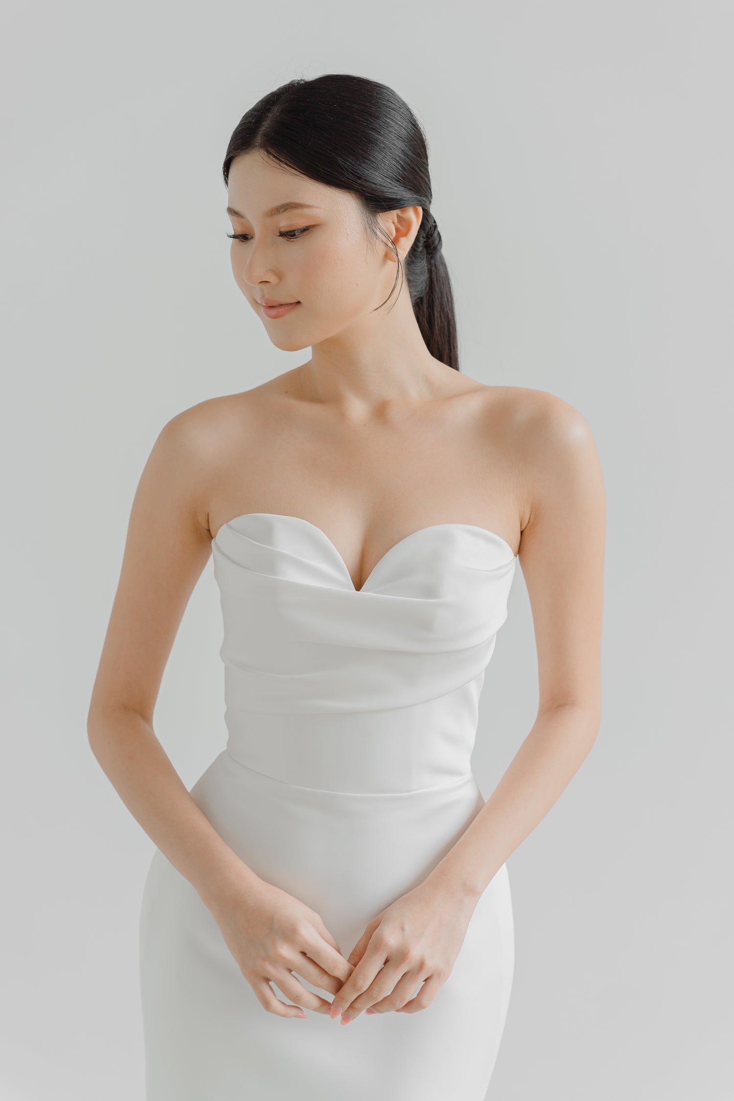 Noelle bridal gown side view showcasing the elegant fitted silhouette