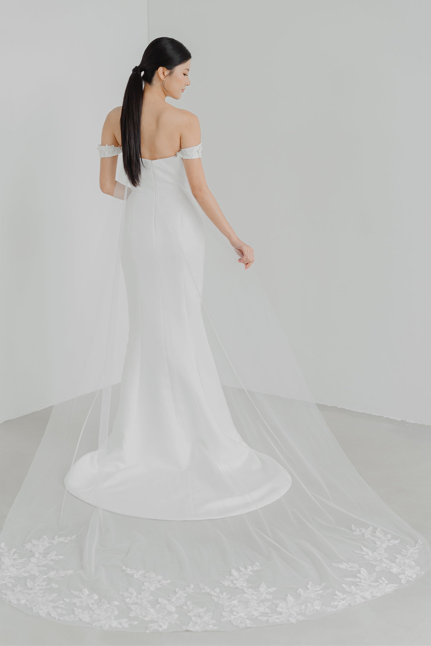 Noelle bridal gown with the detachable lace tulle train creating a romantic bridal look