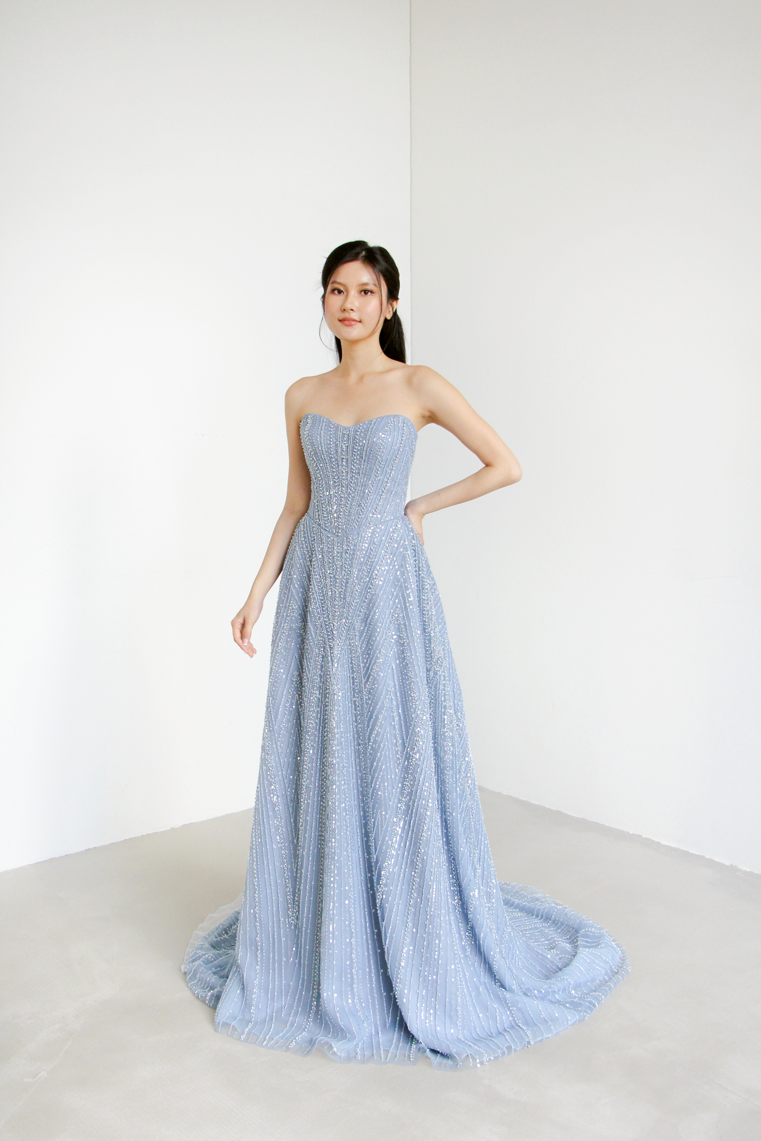 Nova evening gown front view with a subtle sweetheart neckline and sculpted basque waist