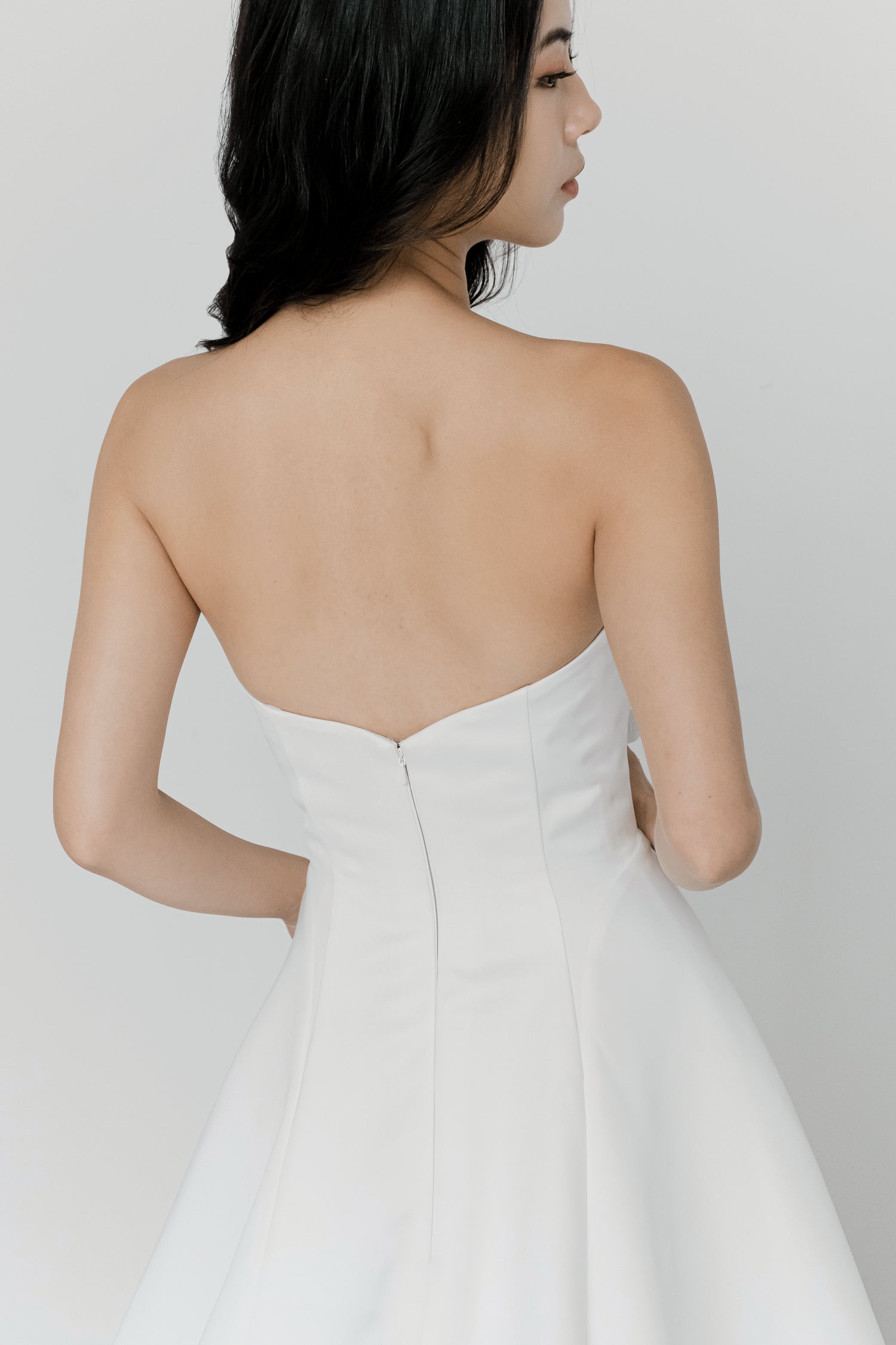 Oakley bridal gown back view with a clean minimalist satin design