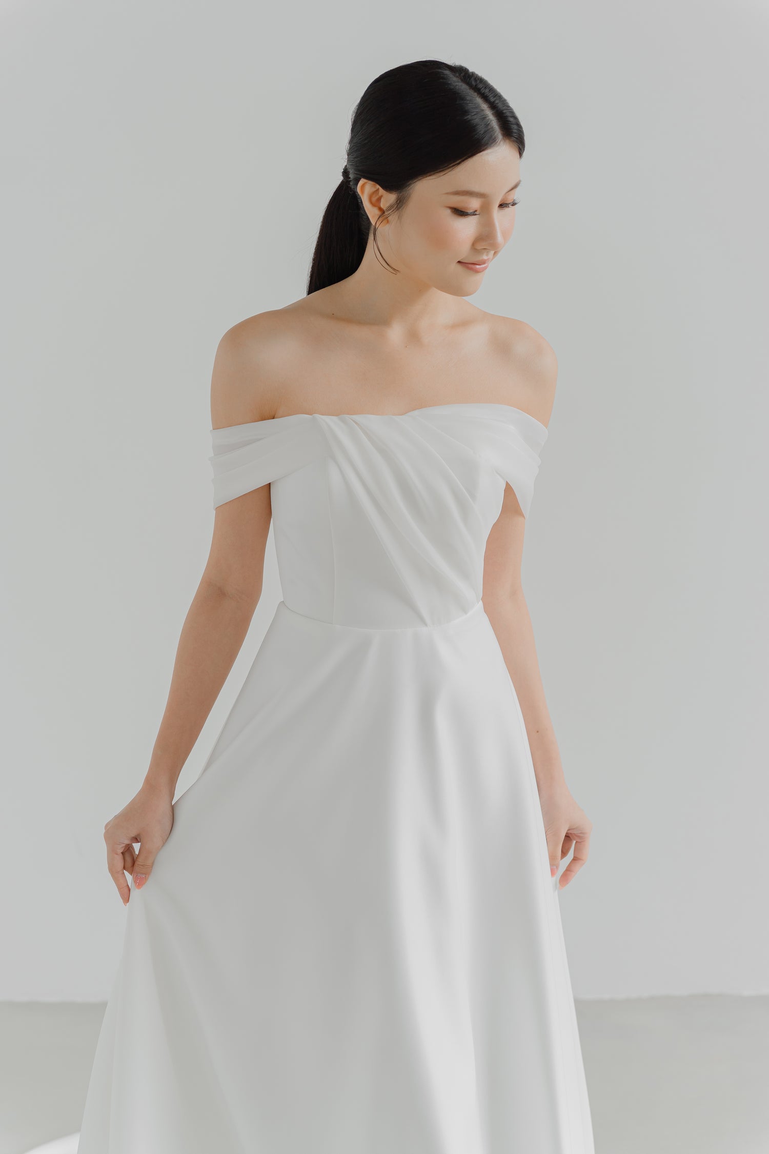 Odena wedding dress featuring delicate pleated organza detailing