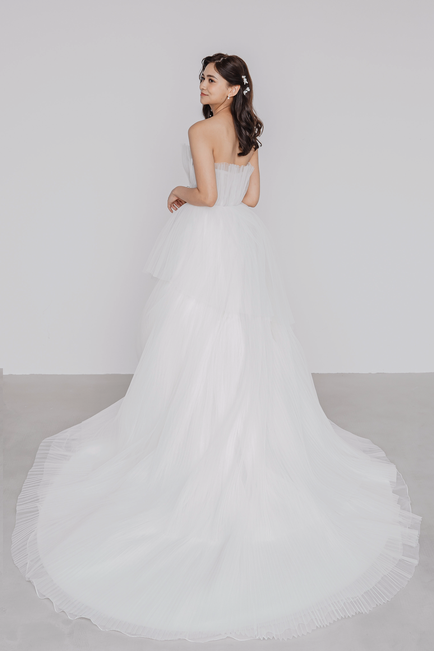 Oriya bridal gown back view with a full pleated tulle silhouette