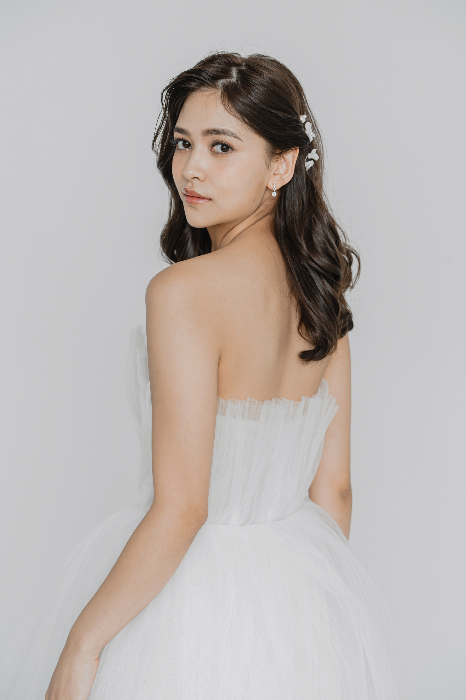 Oriya bridal gown featuring finely pleated tulle and tiered layers