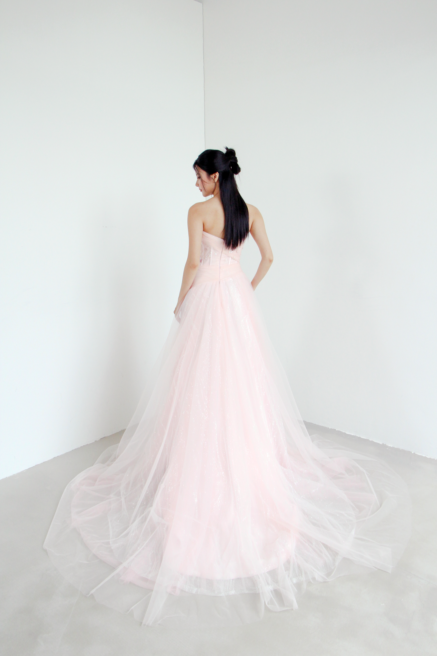 Paisley evening gown train showcasing the flowing glitter tulle and romantic lace accents