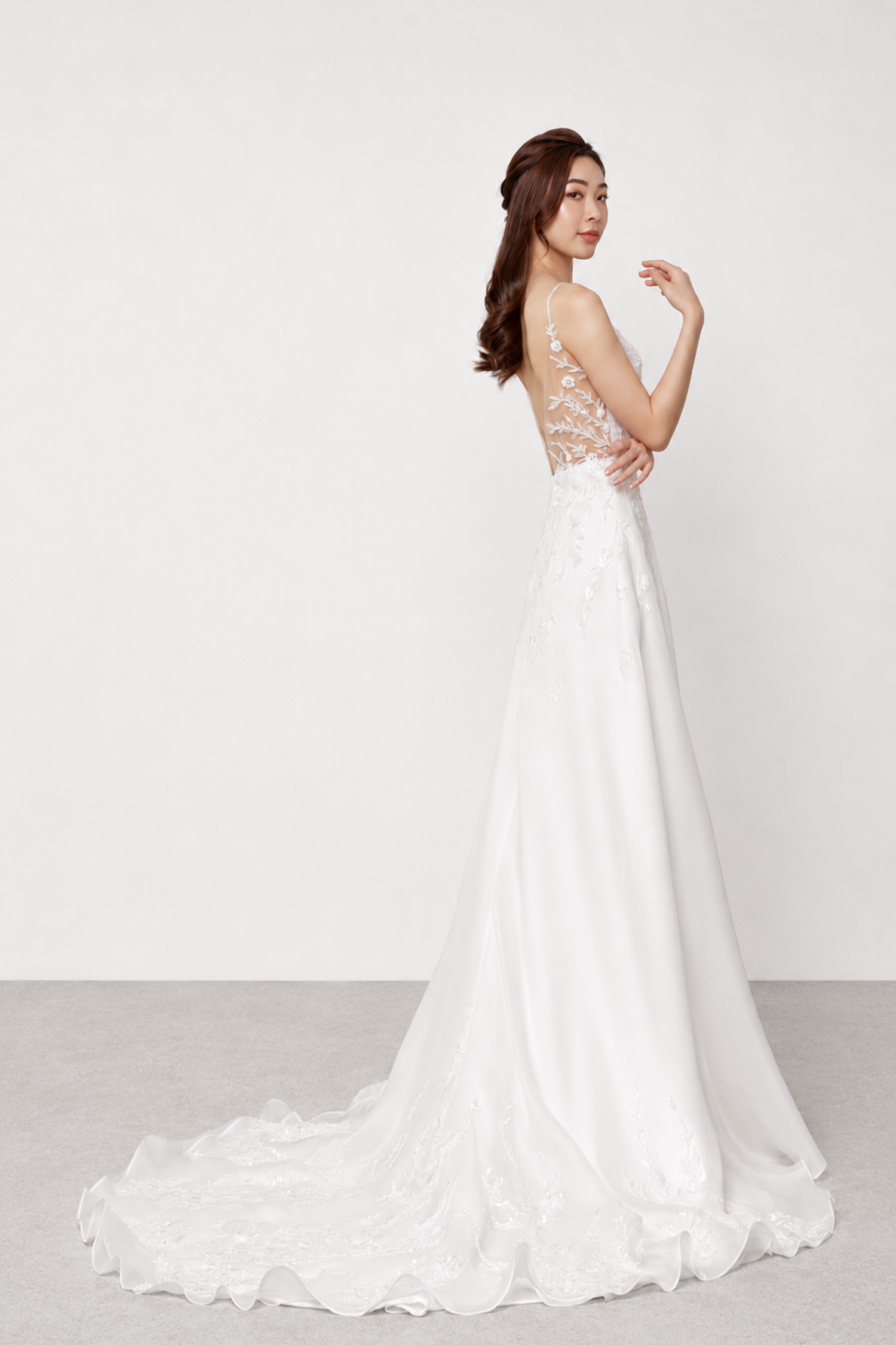 Phoebe bridal gown side view showcasing the flowing organza silhouette