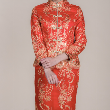 Red and gold embroidered wedding kua rental by WeddingCrafters in Singapore with intricate floral motifs, perfect for traditional Chinese tea ceremonies.