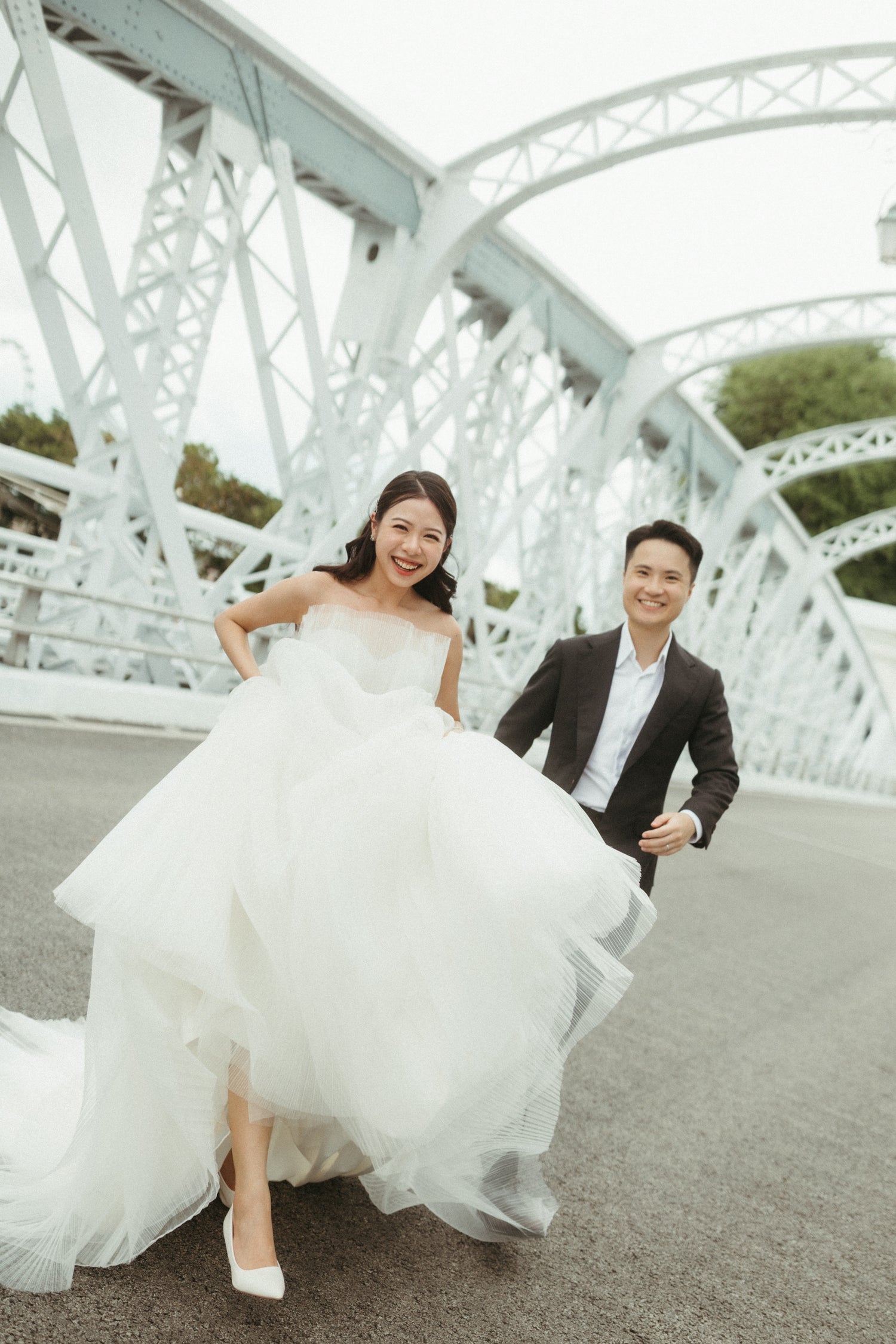 Bride researching wedding gown styles, silhouettes and fabrics at WeddingCrafters to prepare for her bridal consultation in Singapore.