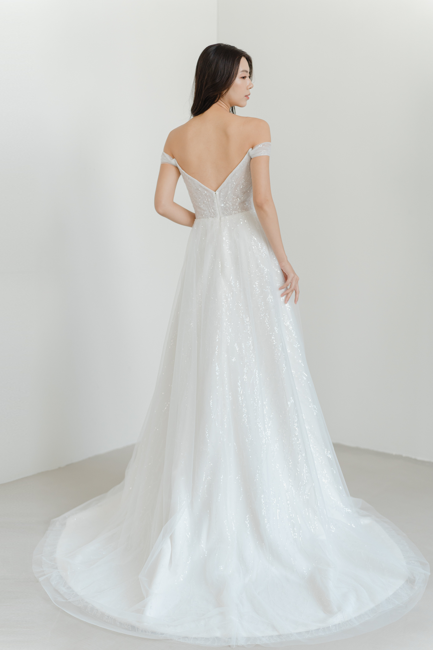 Riley bridal gown back view with an elegant flowing silhouette