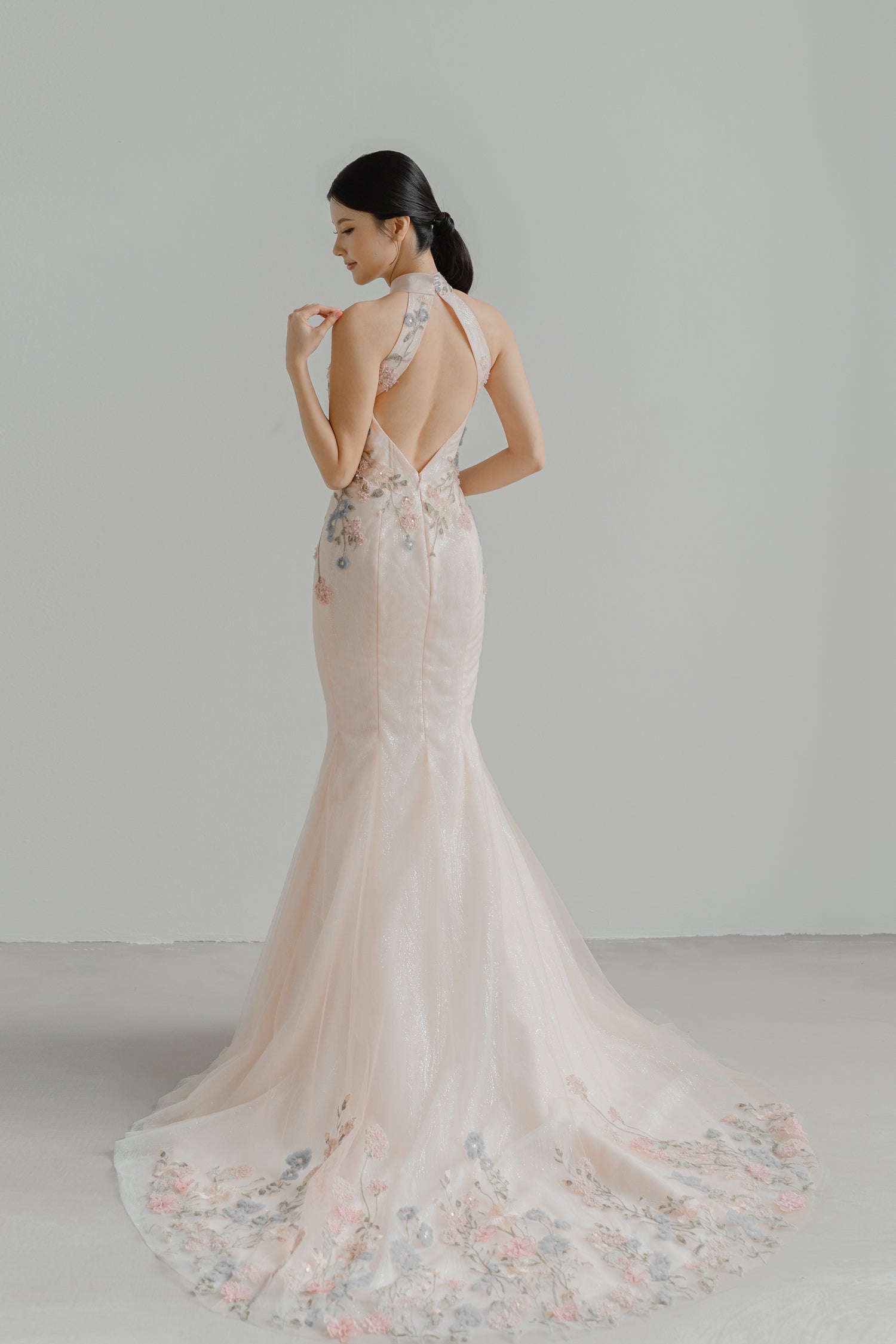 Rowan bridal cheongsam back view with an elegant lace design