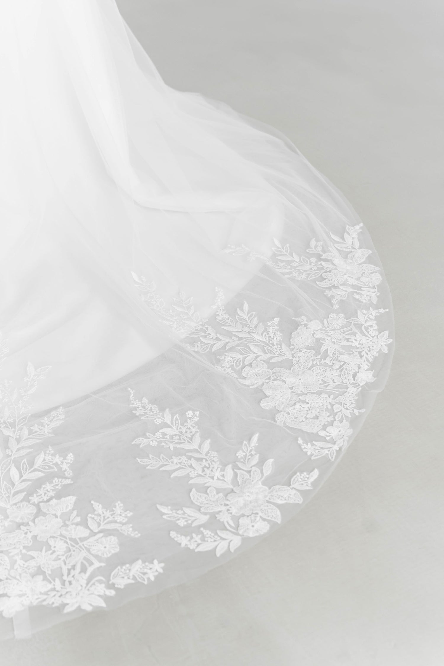 Close-up of Ruth wedding dress highlighting the intricate lace and hand-sewn pearl detailing