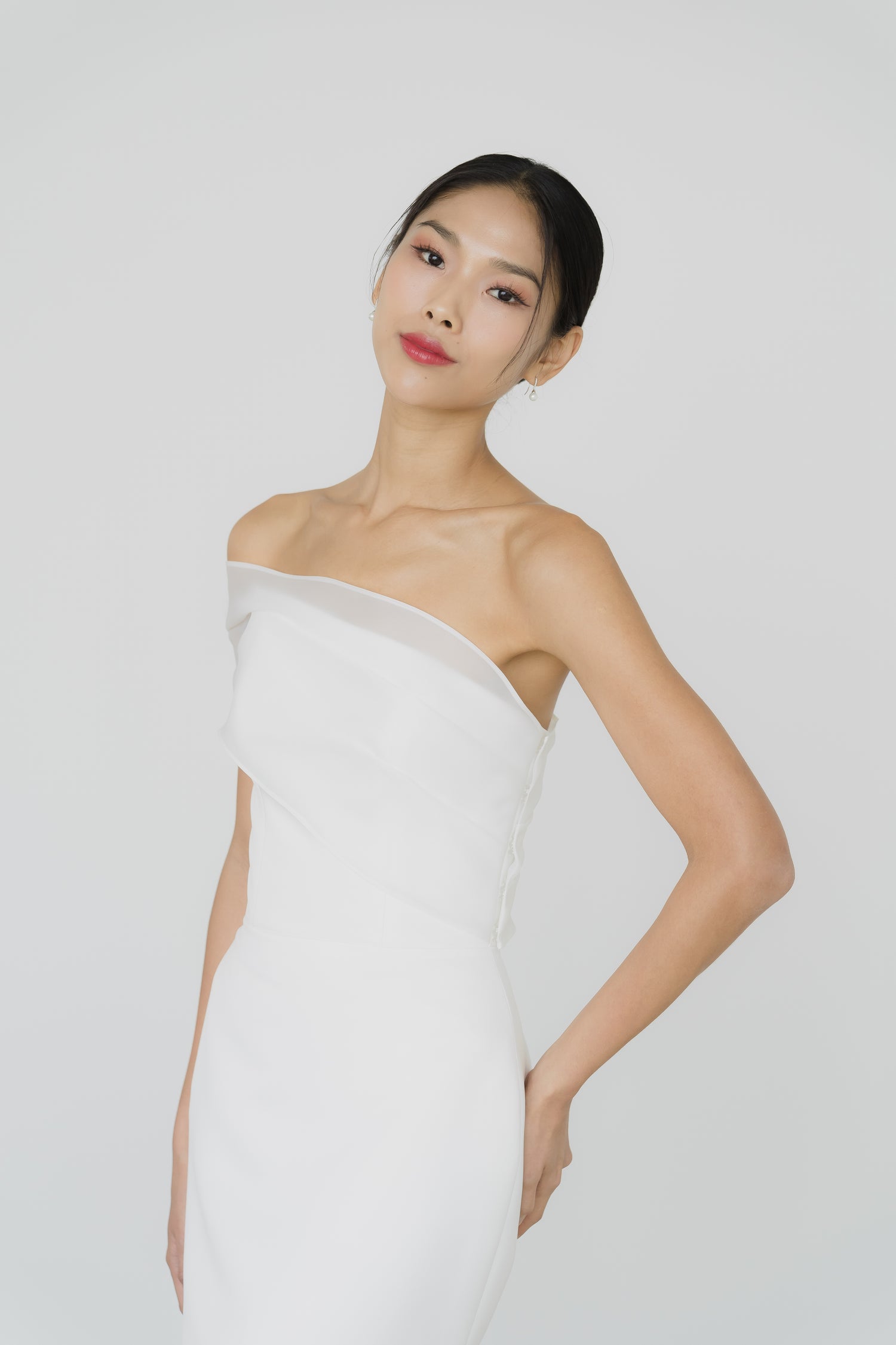 Sabrina bridal gown front view with a sleek satin mermaid silhouette and one-shoulder organza wrap