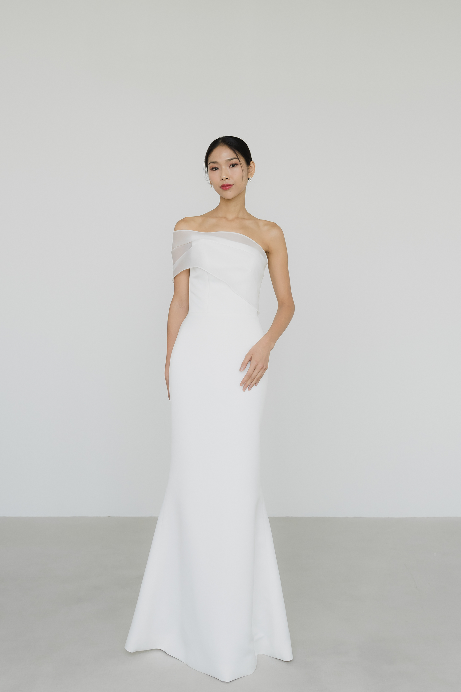 Sabrina bridal gown front view with a sleek satin mermaid silhouette and one-shoulder organza wrap