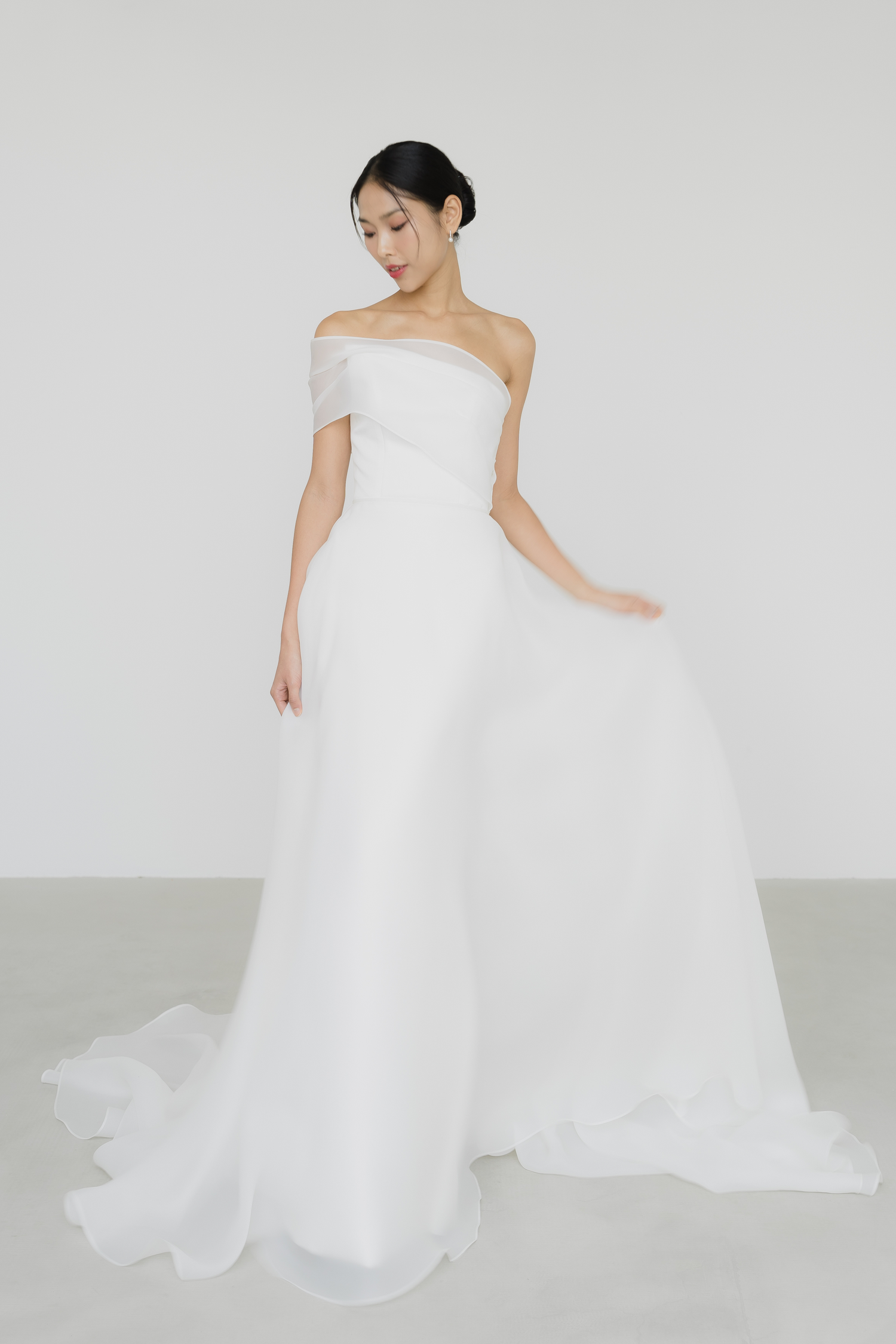 Close-up of Sabrina wedding gown highlighting the detachable organza overskirt