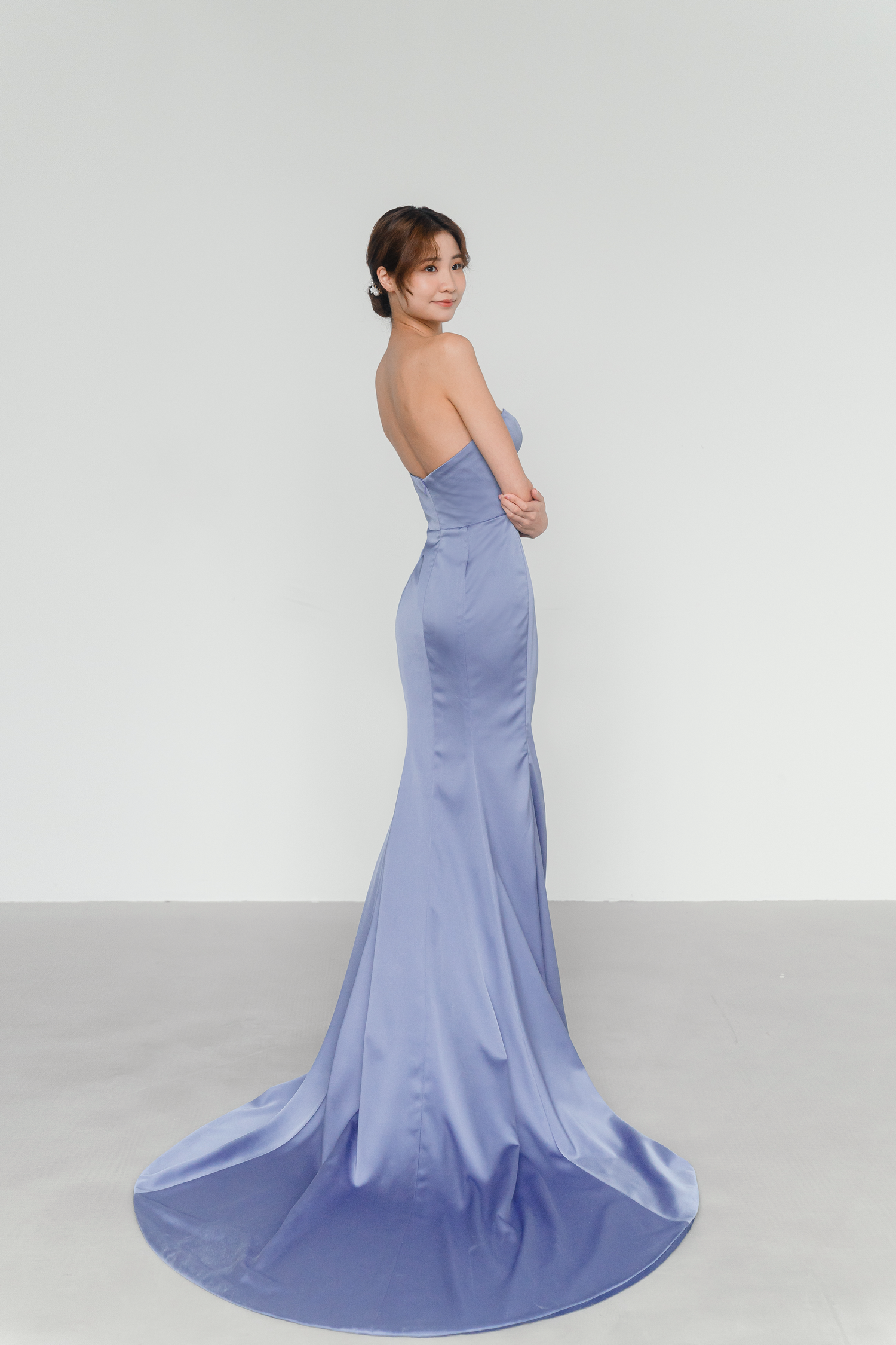 Sadie bridal evening gown side view with a figure-skimming satin silhouette