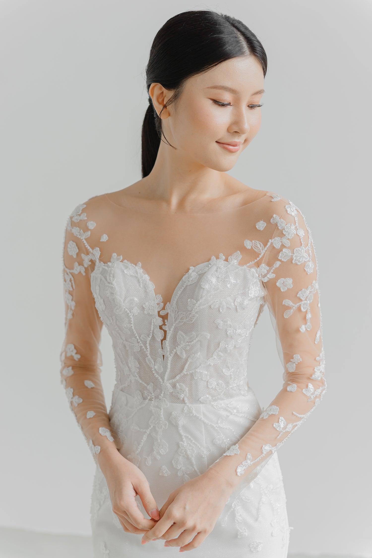 Sandra wedding dress front view with illusion lace long sleeves and a mermaid silhouette