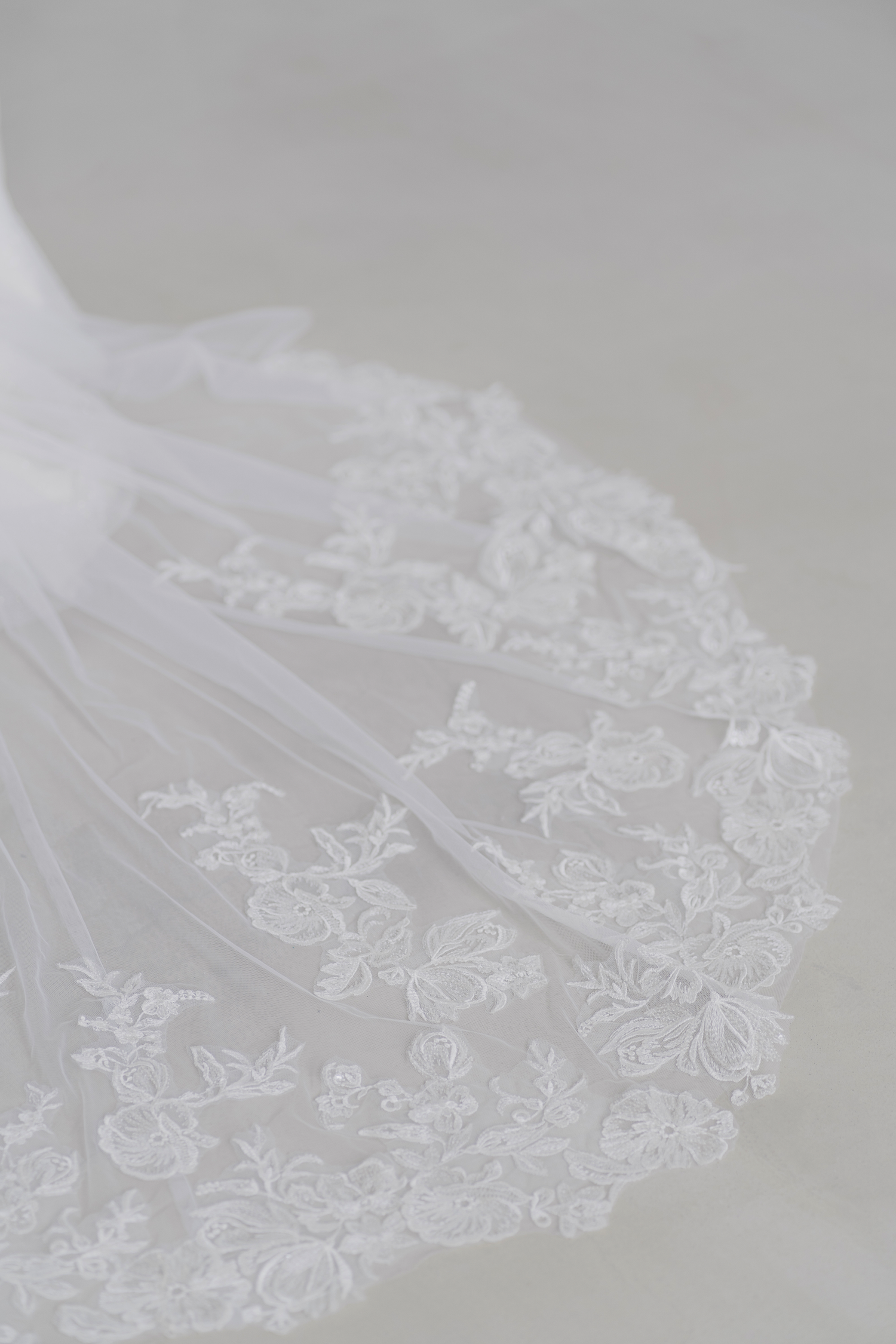 Selina wedding dress featuring an intricate scalloped train