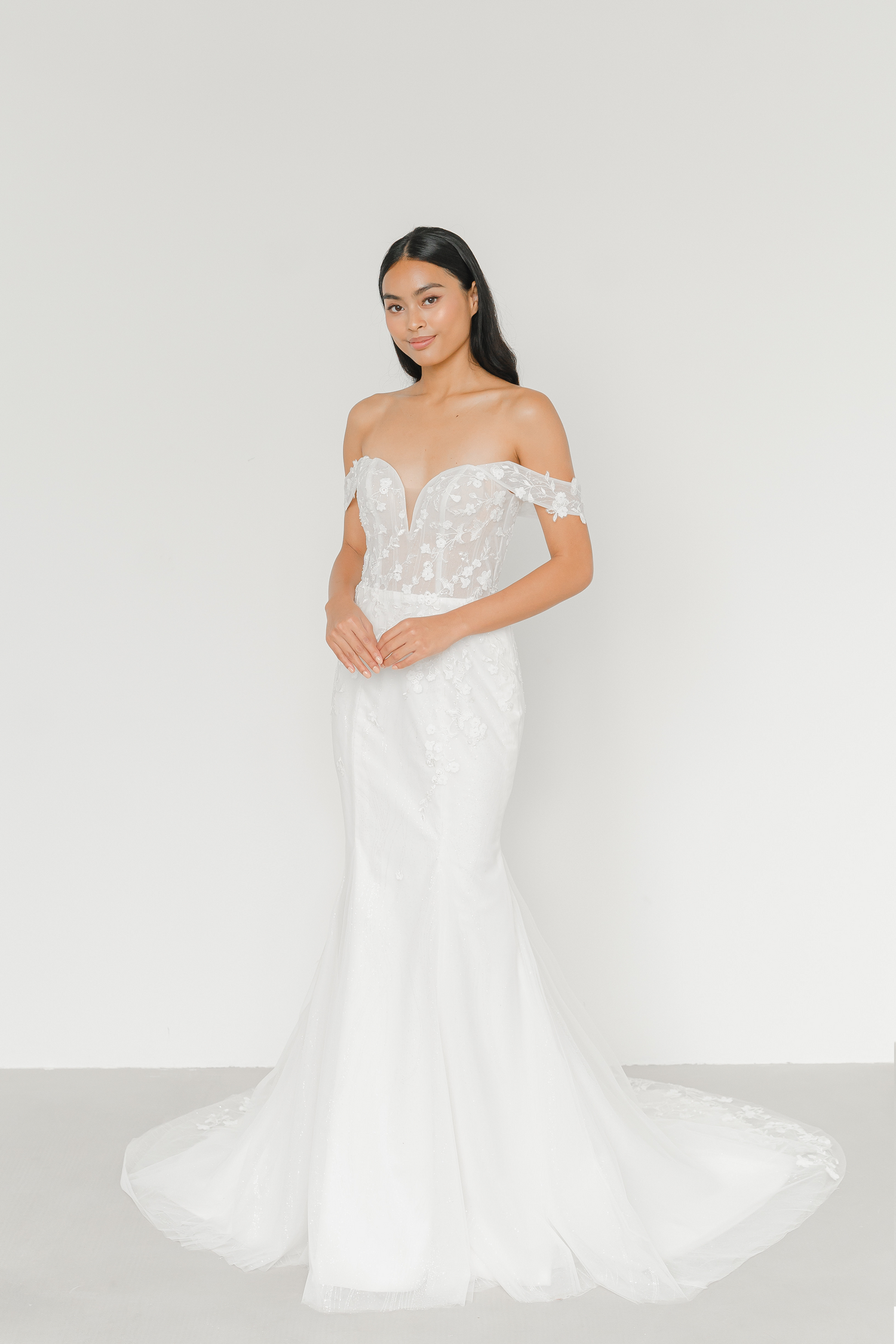 Shanice wedding dress front view with a sweetheart neckline and floral lace appliqués