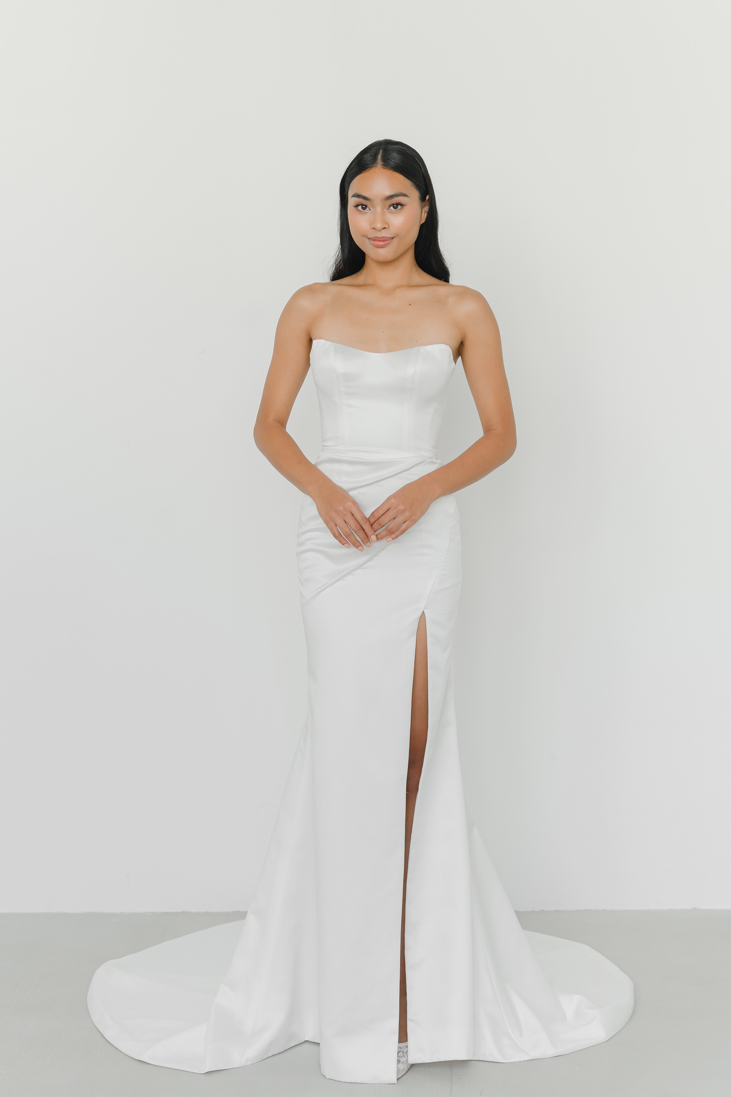 Shanna evening dress featuring soft pleated waist detailing and a figure-skimming silhouette