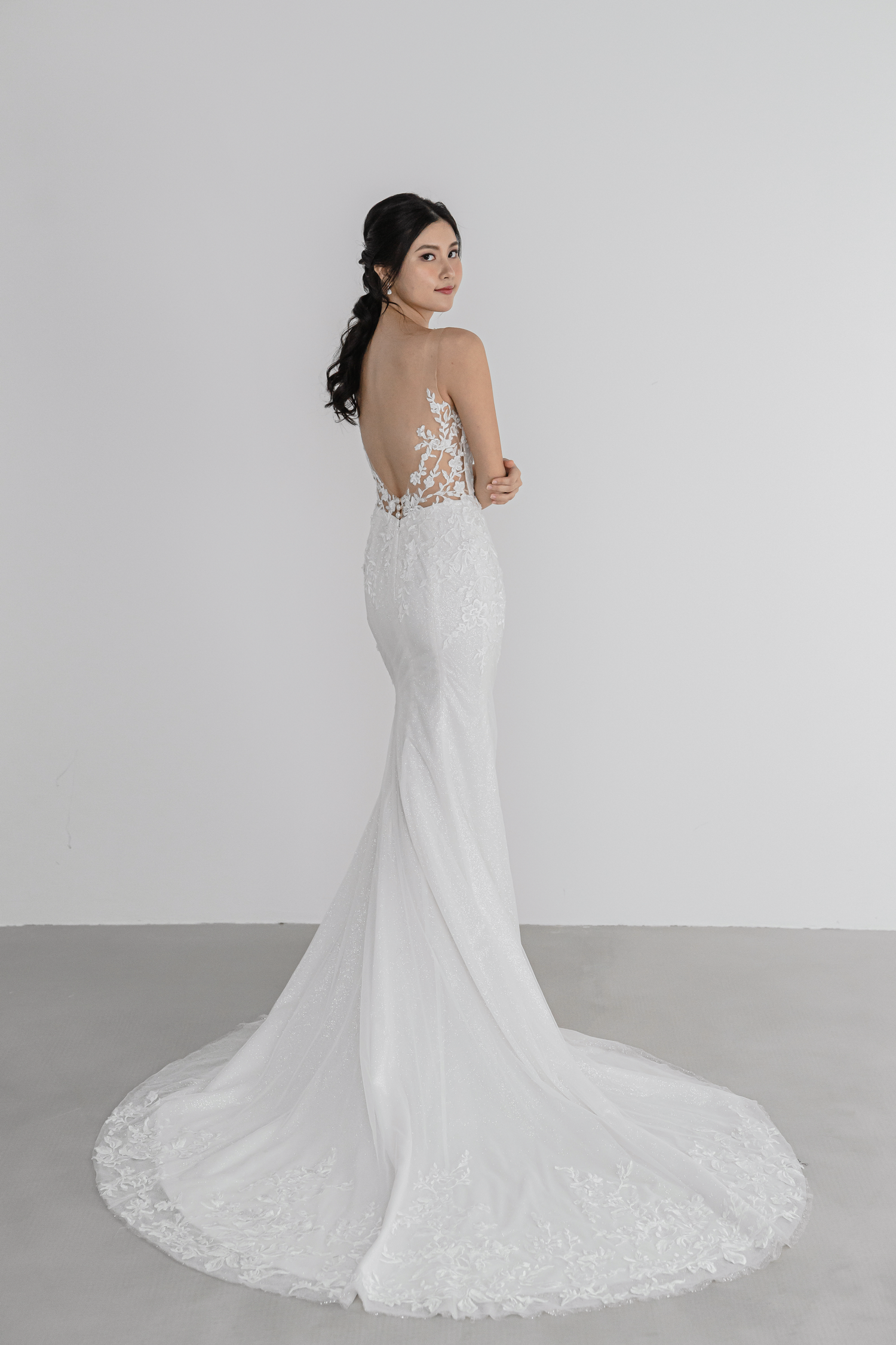 Sheila wedding gown side view with a fitted mermaid silhouette