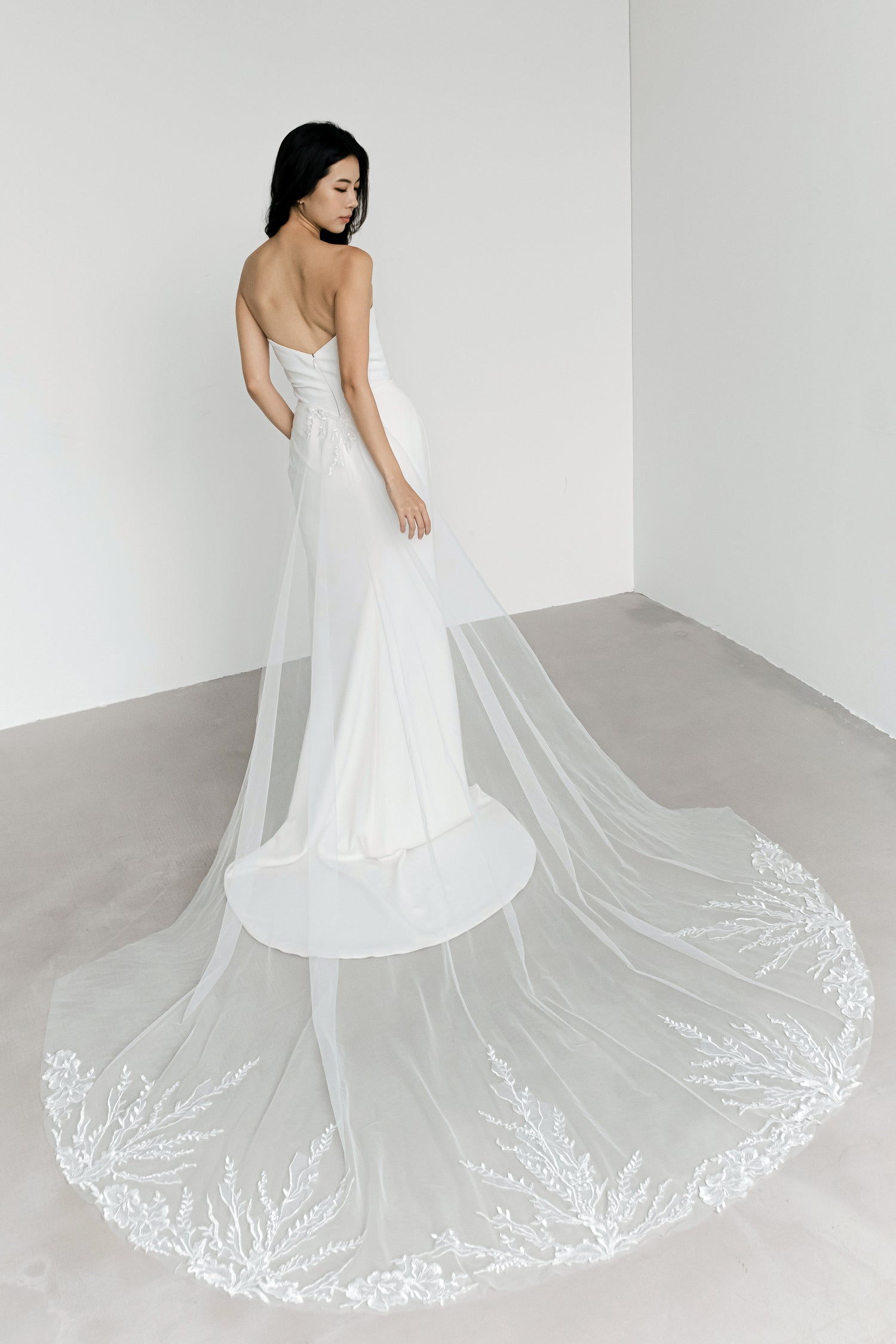 Sybil bridal evening gown train showcasing the smooth crepe fabric and graceful train