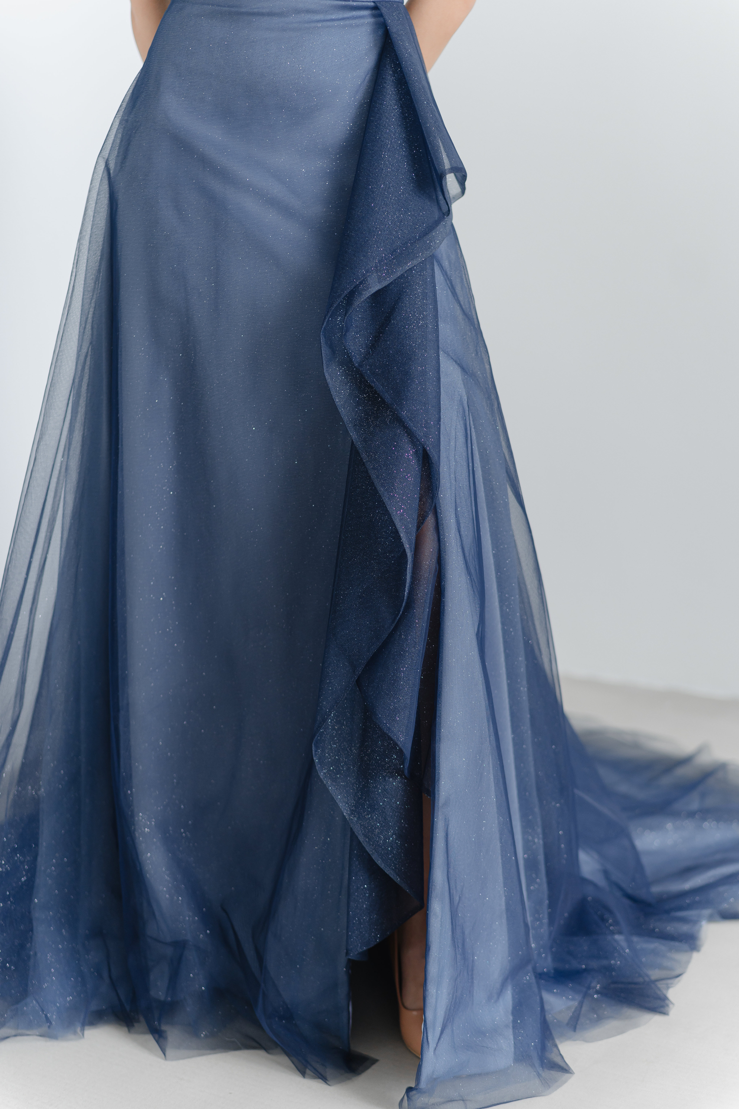 Close-up of Sylvie bridal evening gown highlighting the cascading front ruffles