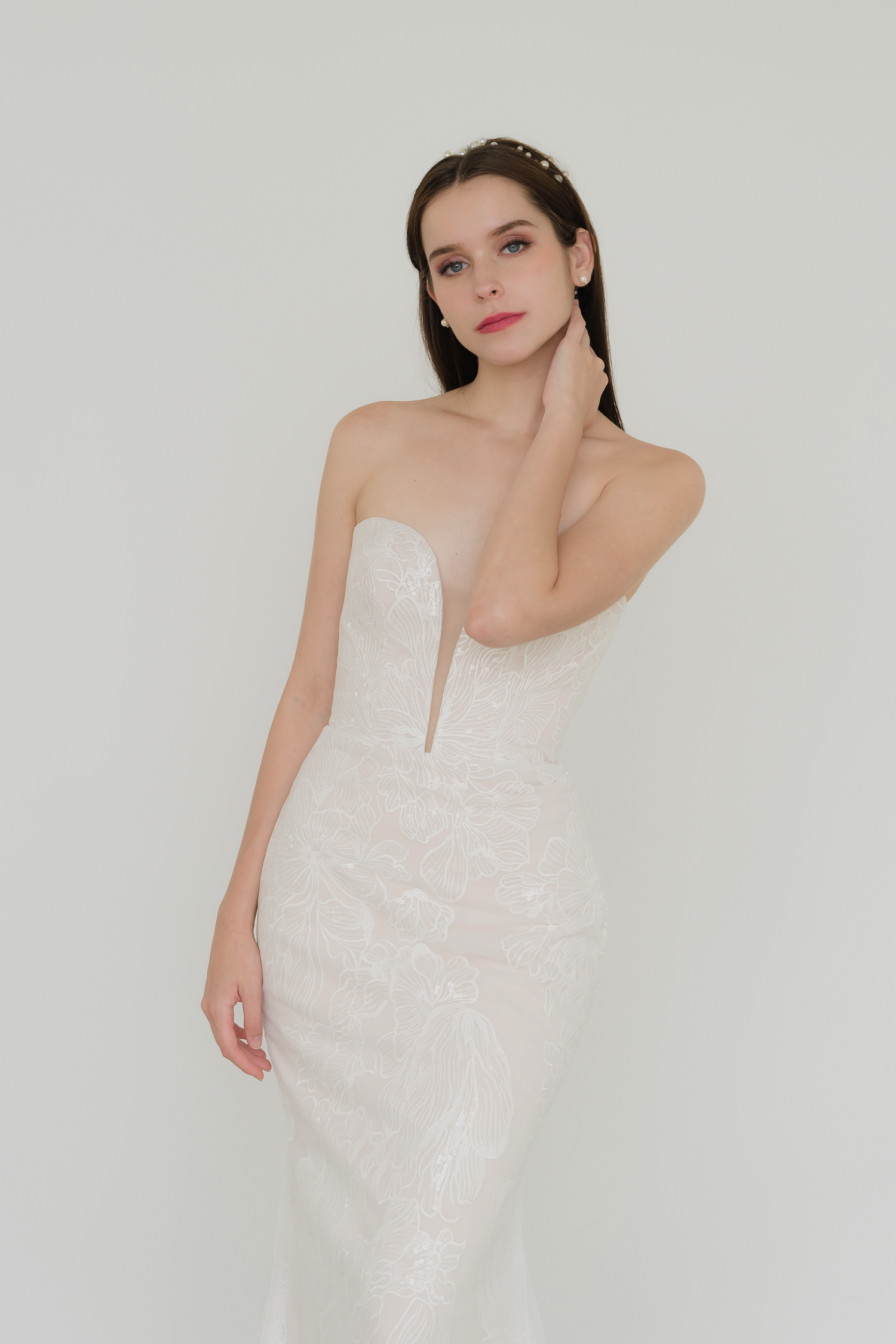 Taylor bridal gown featuring floral lace-patterned tulle over a soft nude base