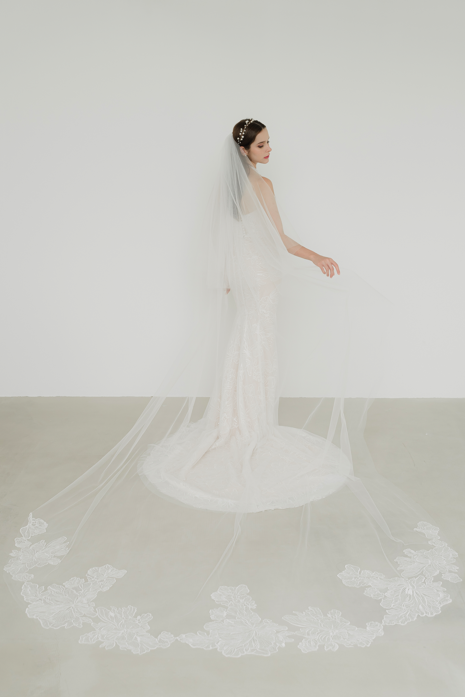 Taylor wedding gown train showcasing the floral lace-patterned tulle and elegant flowing train