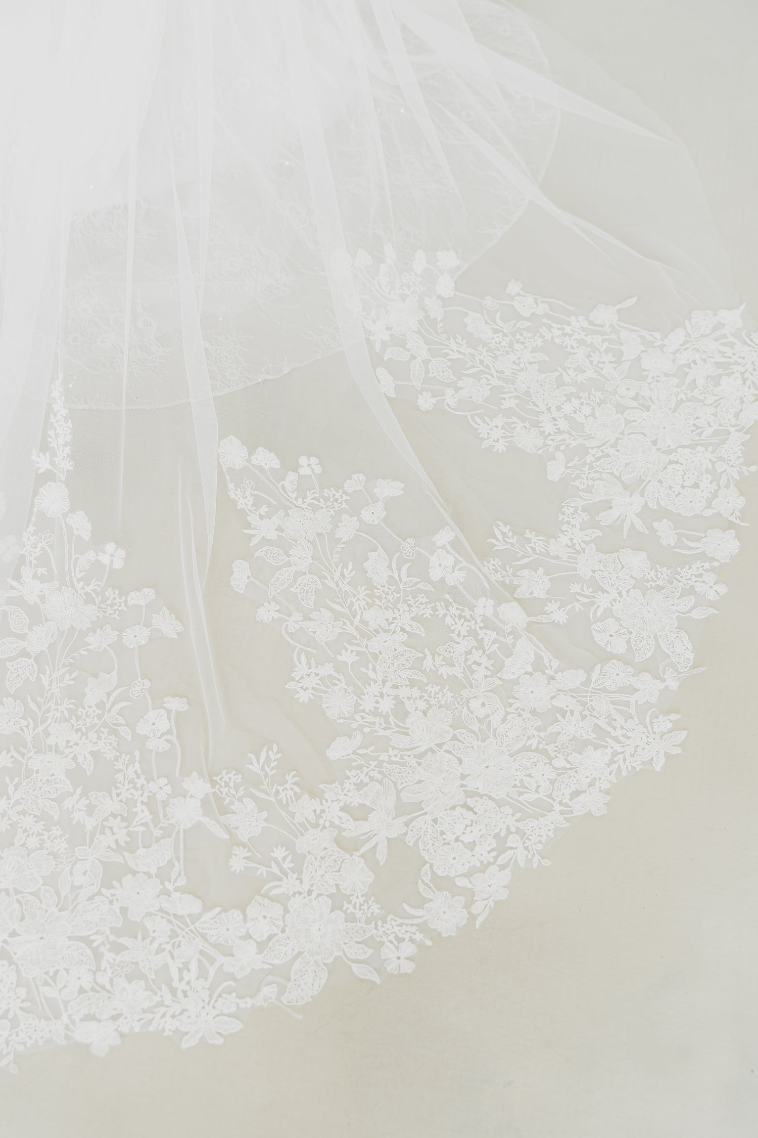 Close-up of Tena wedding dress highlighting the intricate vine and wildflower-inspired lace