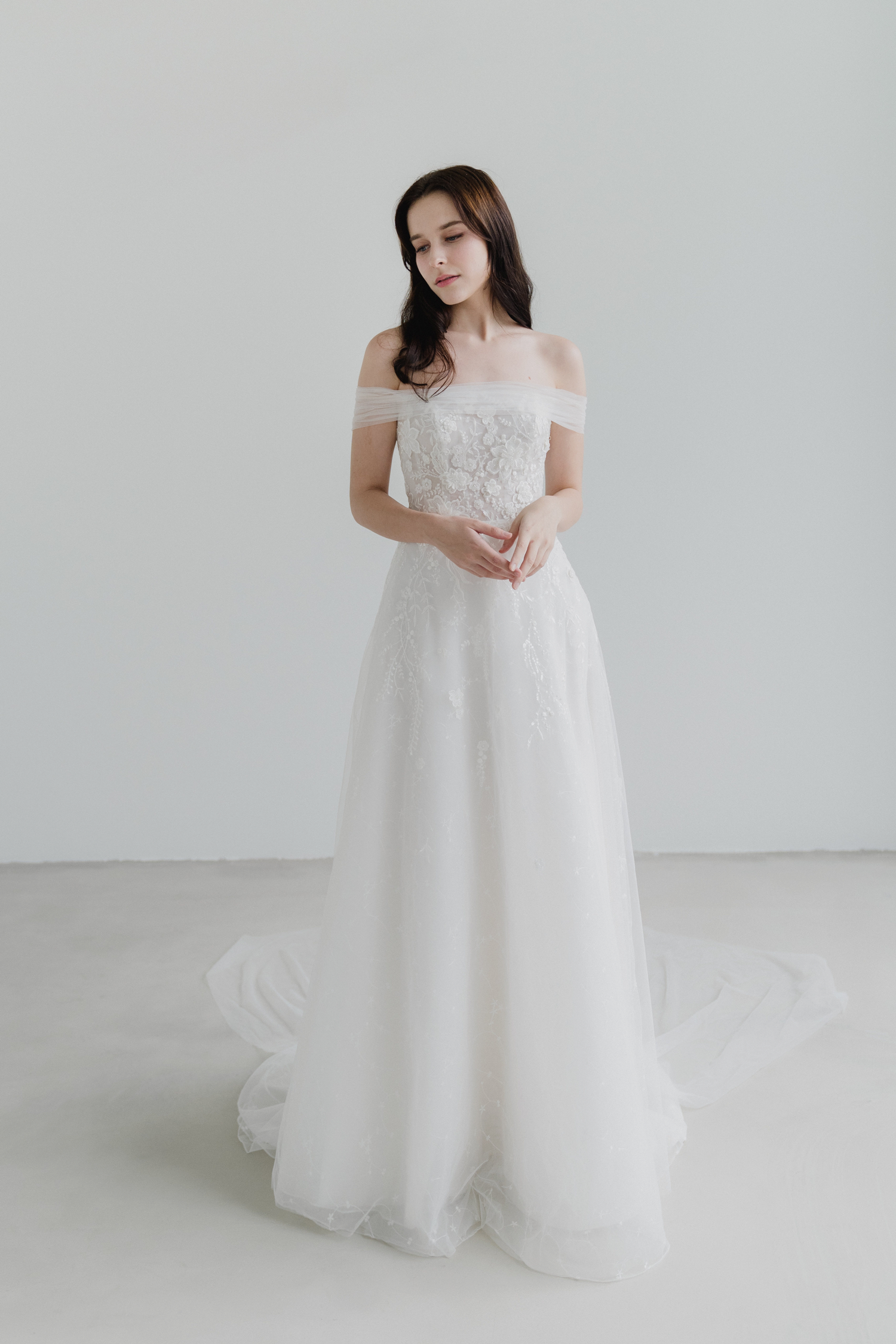 Tracy bridal dress featuring a soft A-line silhouette and floral lace