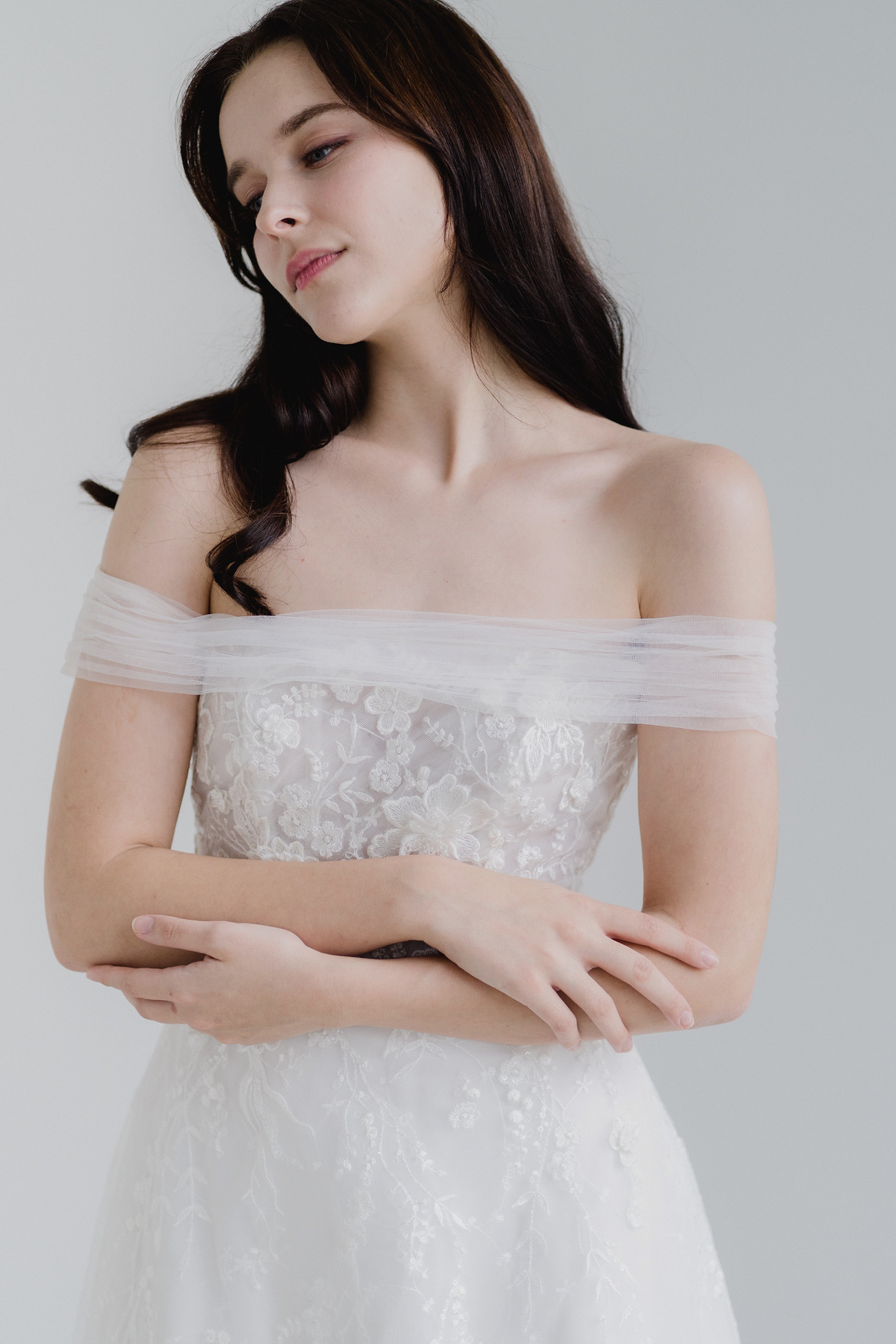 Tracy wedding gown front view with floral lace and off-shoulder tulle sleeves