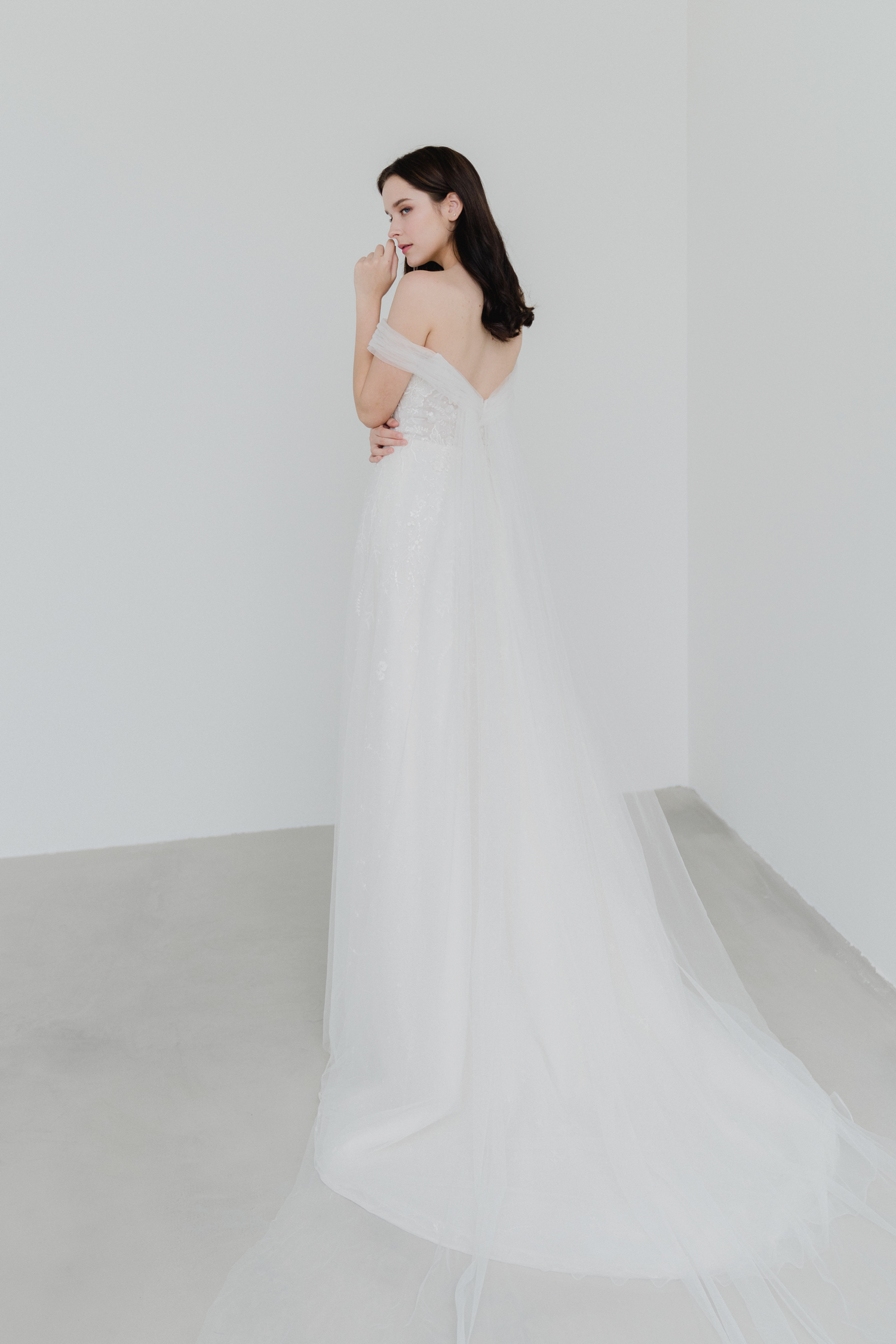 Tracy wedding gown side view with flowing A-line skirt